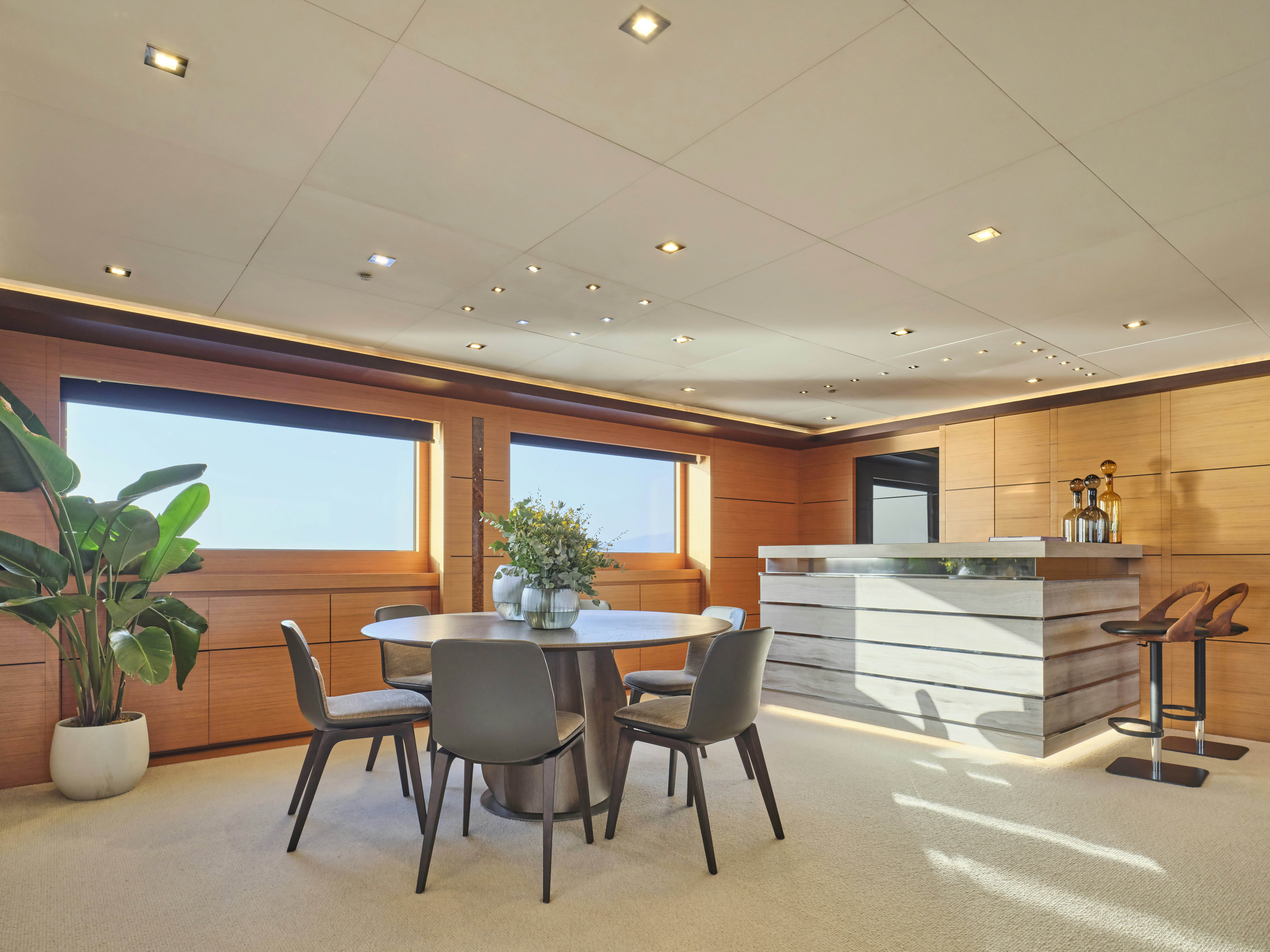 a room with a table and chairs aboard PERSEFONI I Yacht for Charter