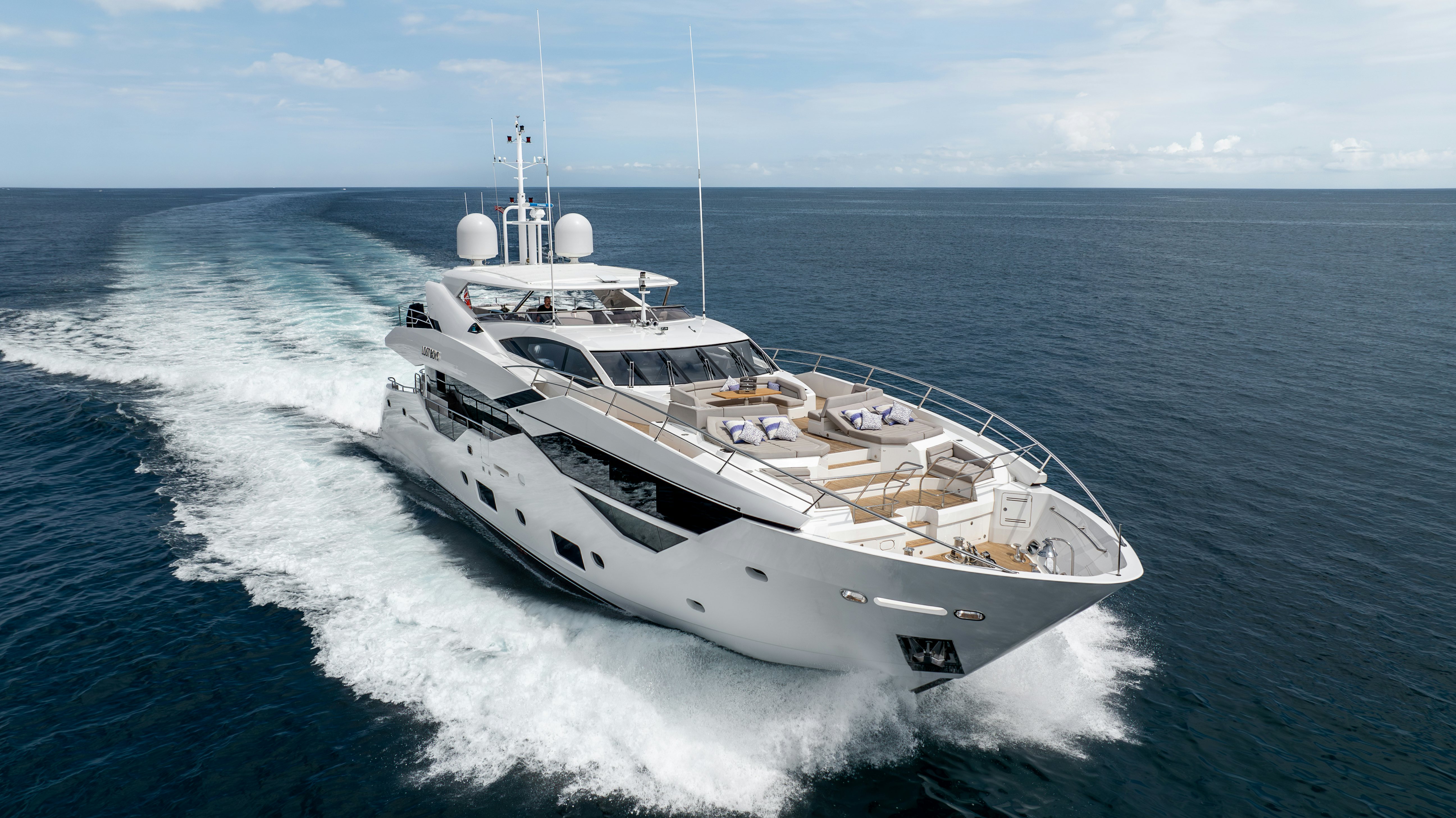 a white boat on the water aboard LOST BOYS Yacht for Sale