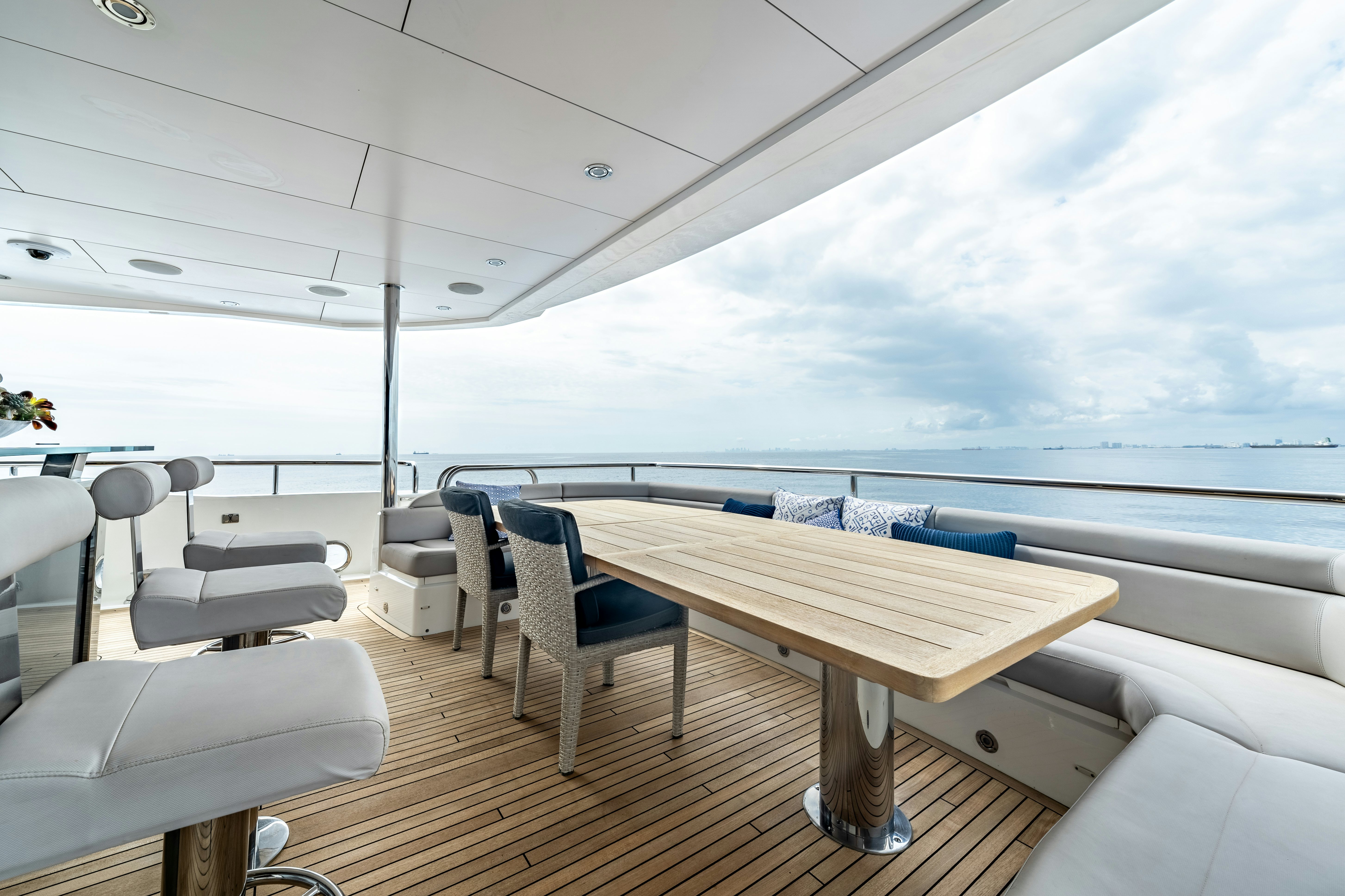 a room with a table and chairs aboard LOST BOYS Yacht for Sale