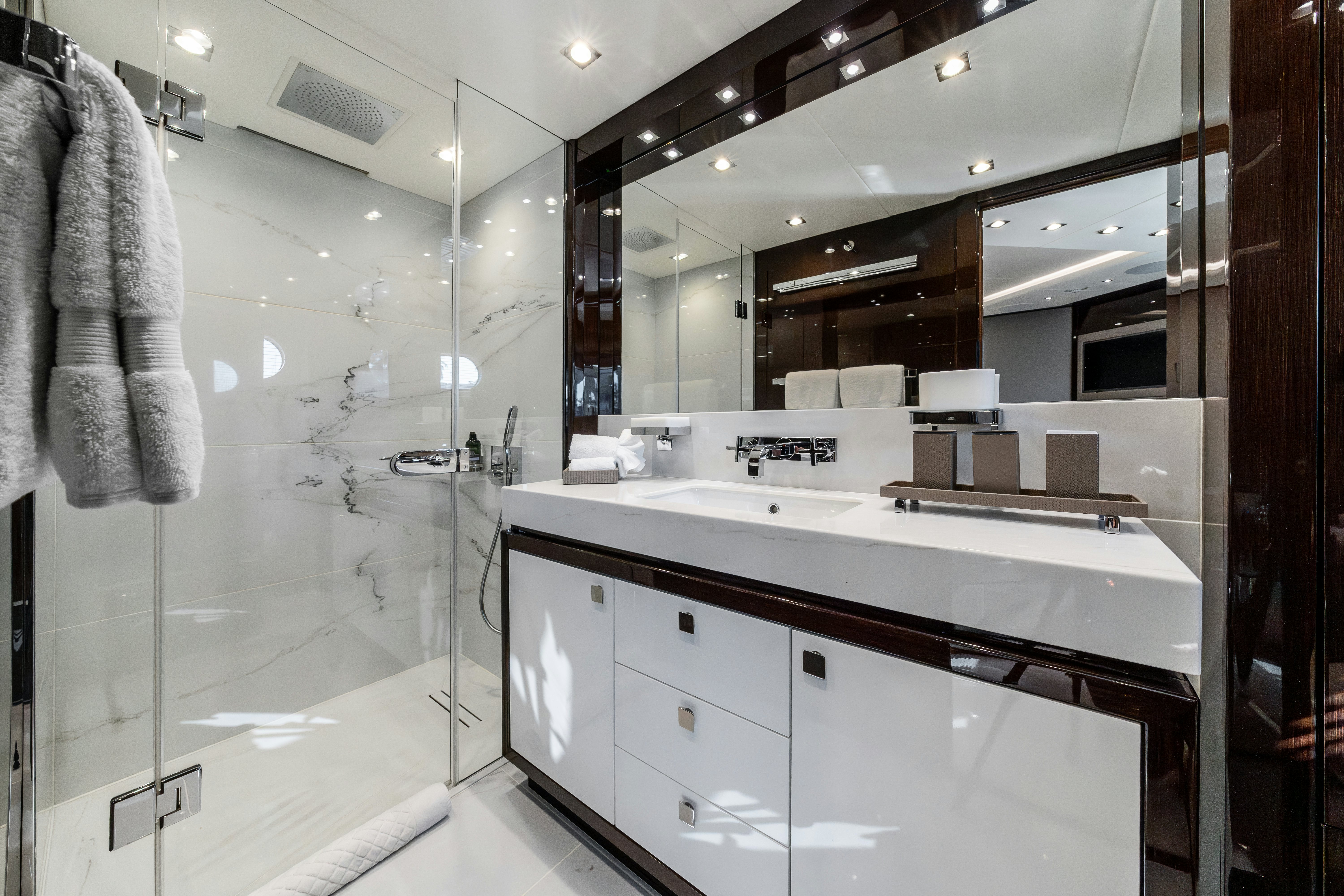 a bathroom with a large mirror aboard LOST BOYS Yacht for Sale