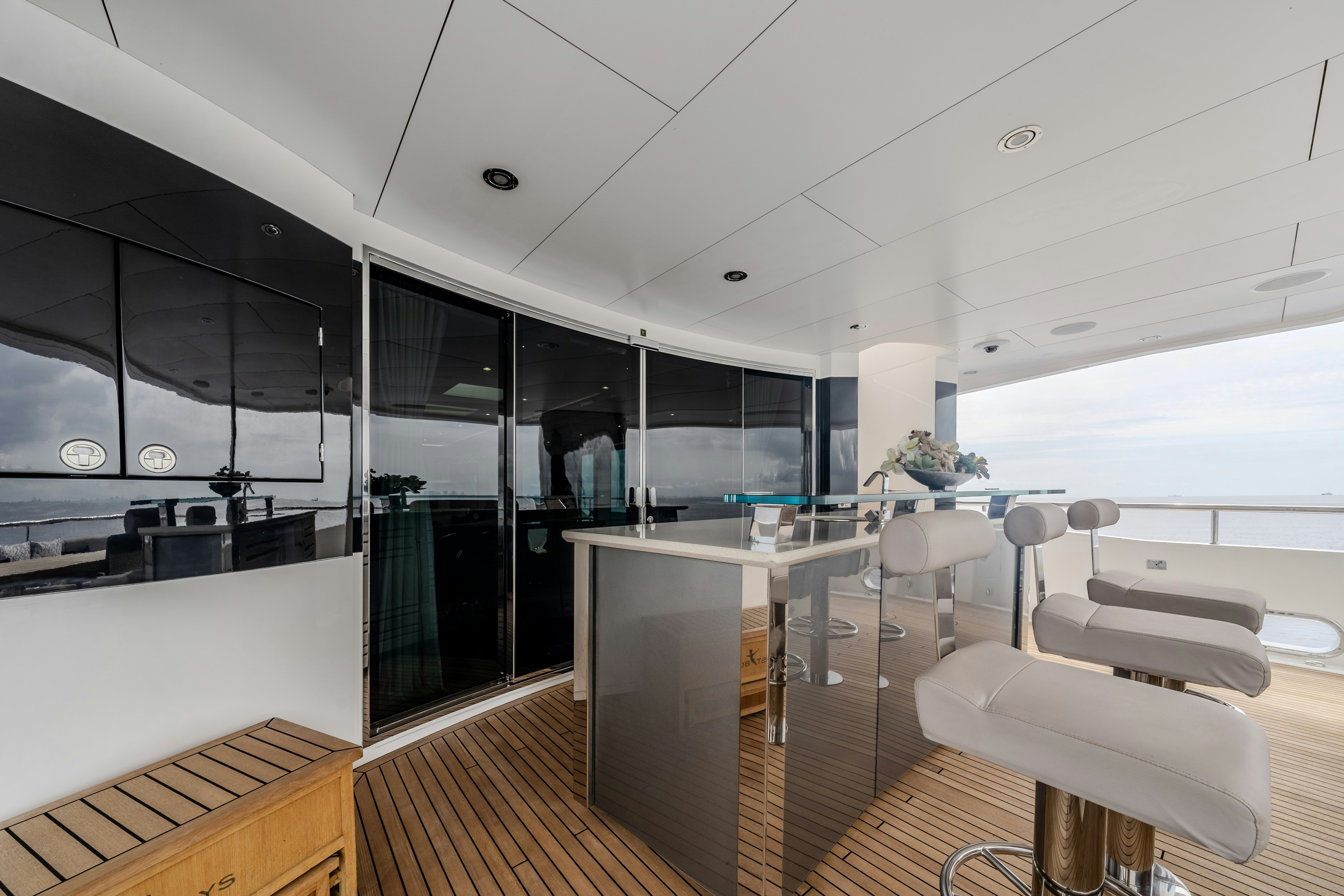 a room with a large glass wall aboard LOST BOYS Yacht for Sale