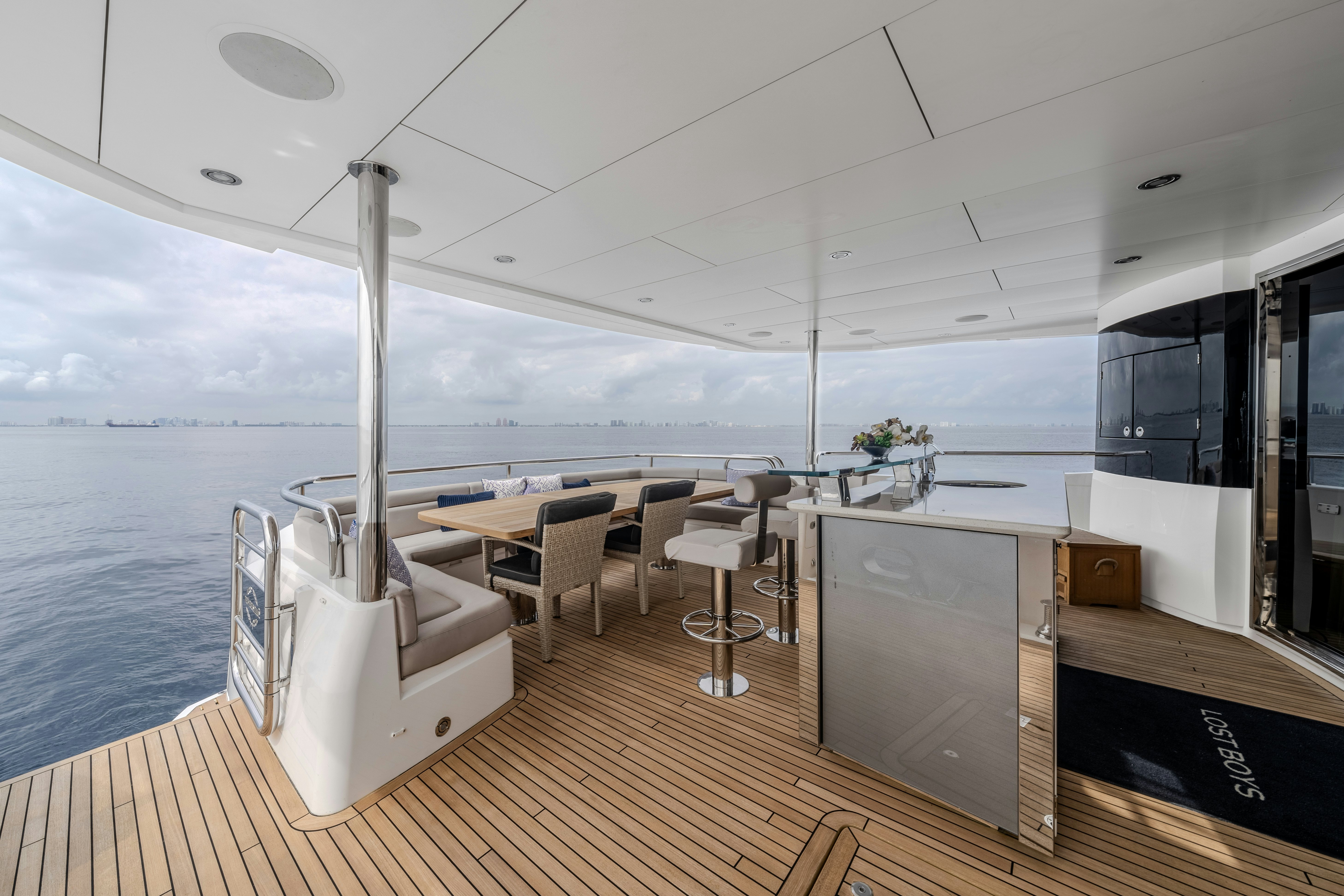 a room with a table and chairs aboard LOST BOYS Yacht for Sale