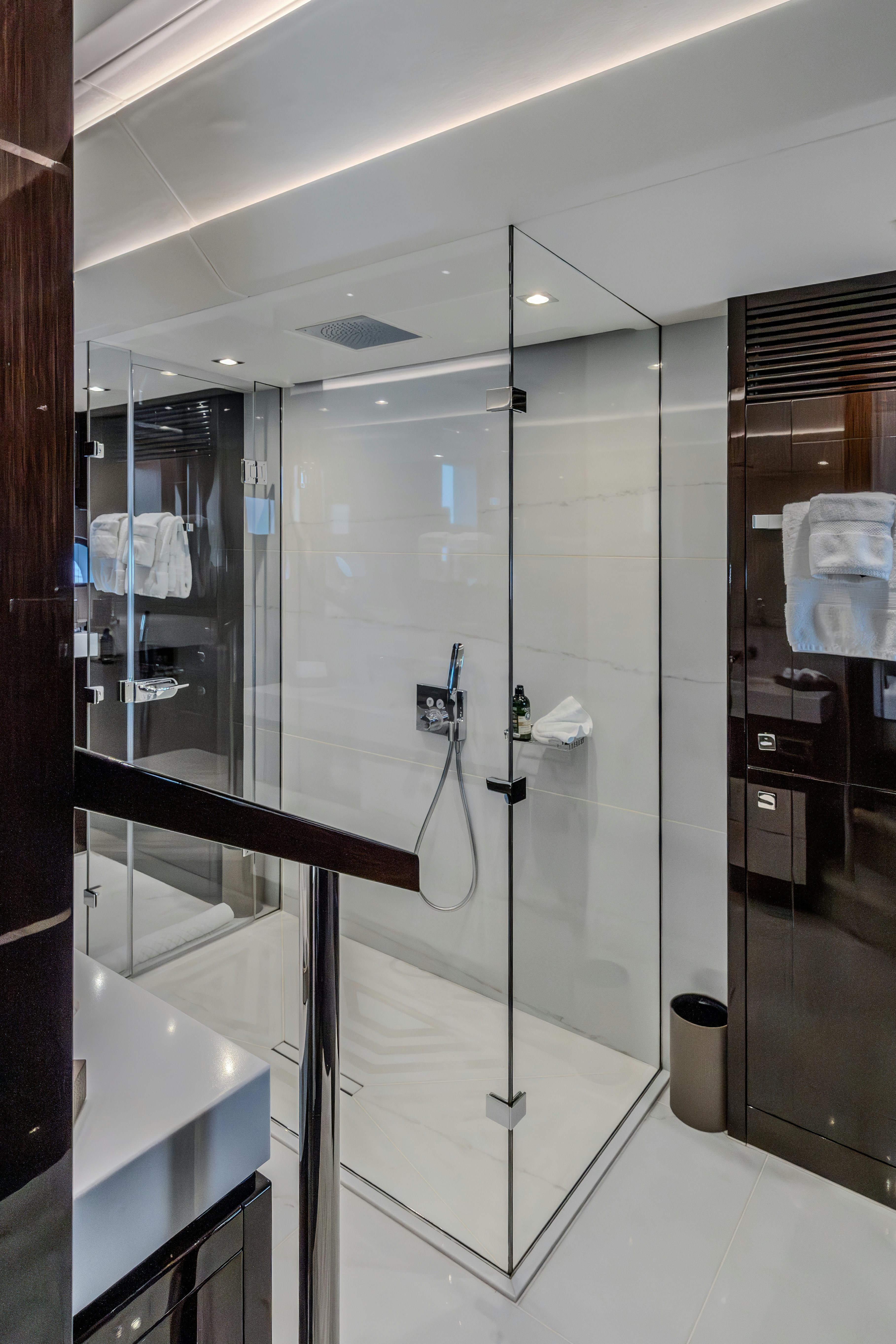 a bathroom with a glass shower aboard LOST BOYS Yacht for Sale