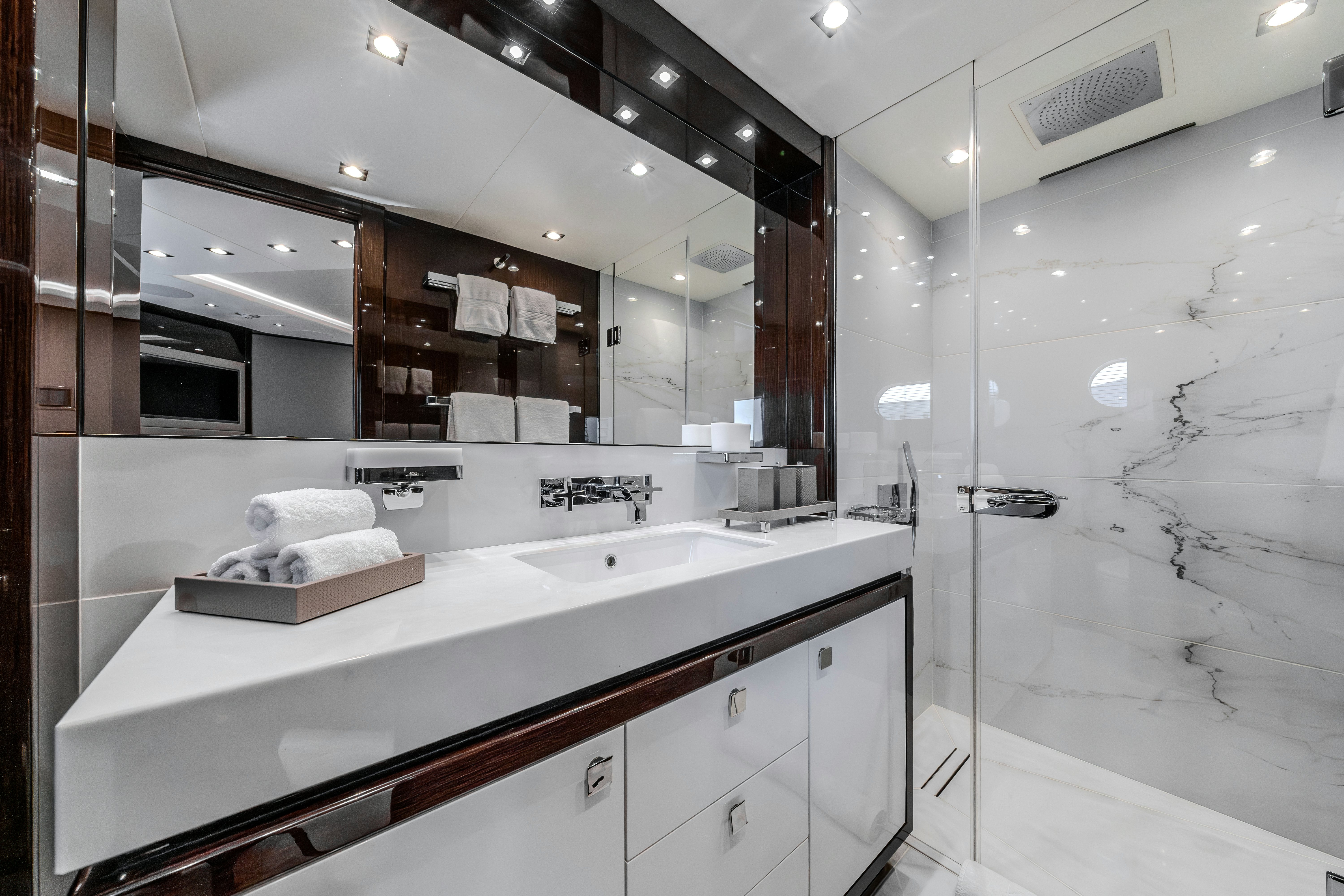 a bathroom with a large mirror aboard LOST BOYS Yacht for Sale