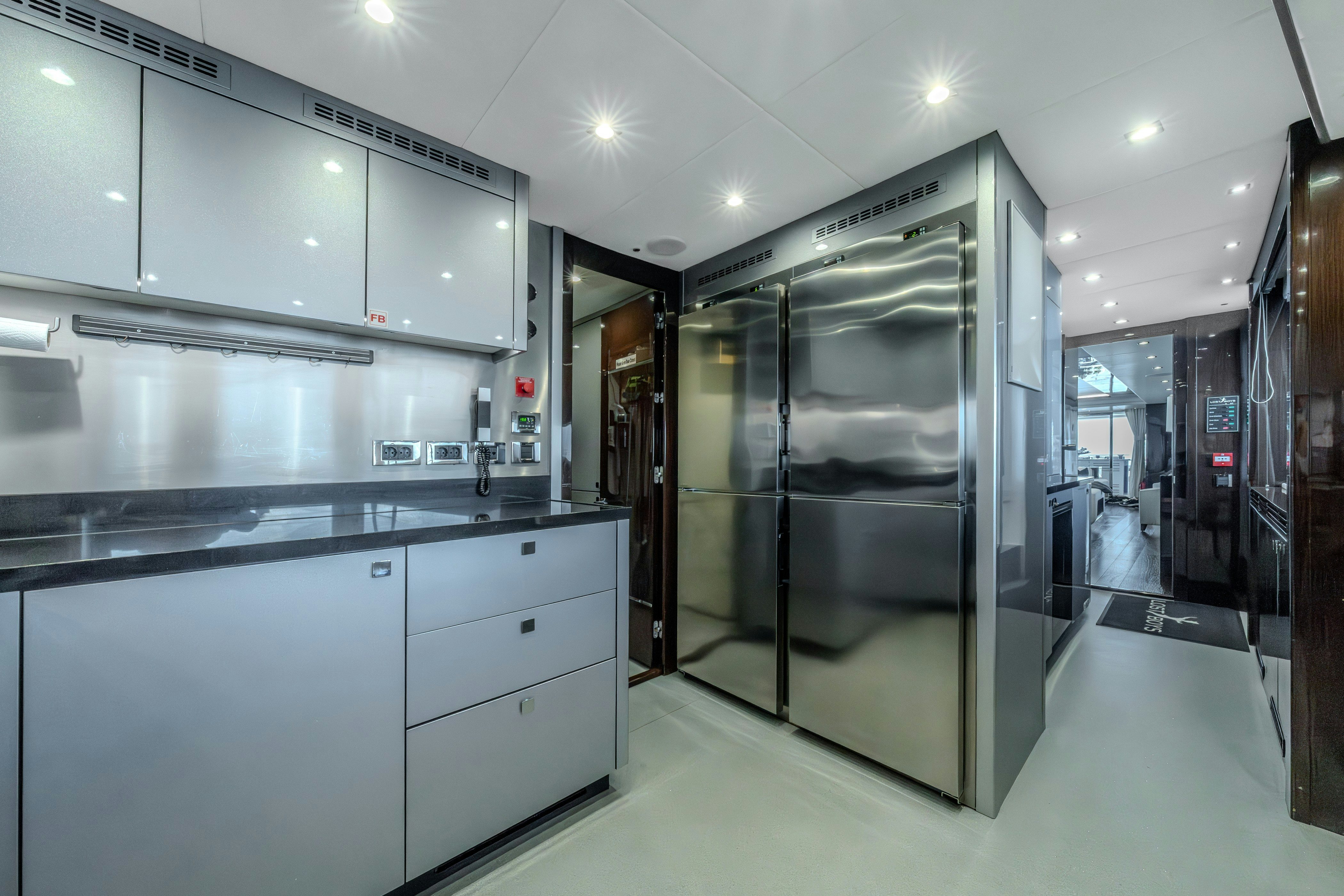 a large kitchen with glass doors aboard LOST BOYS Yacht for Sale