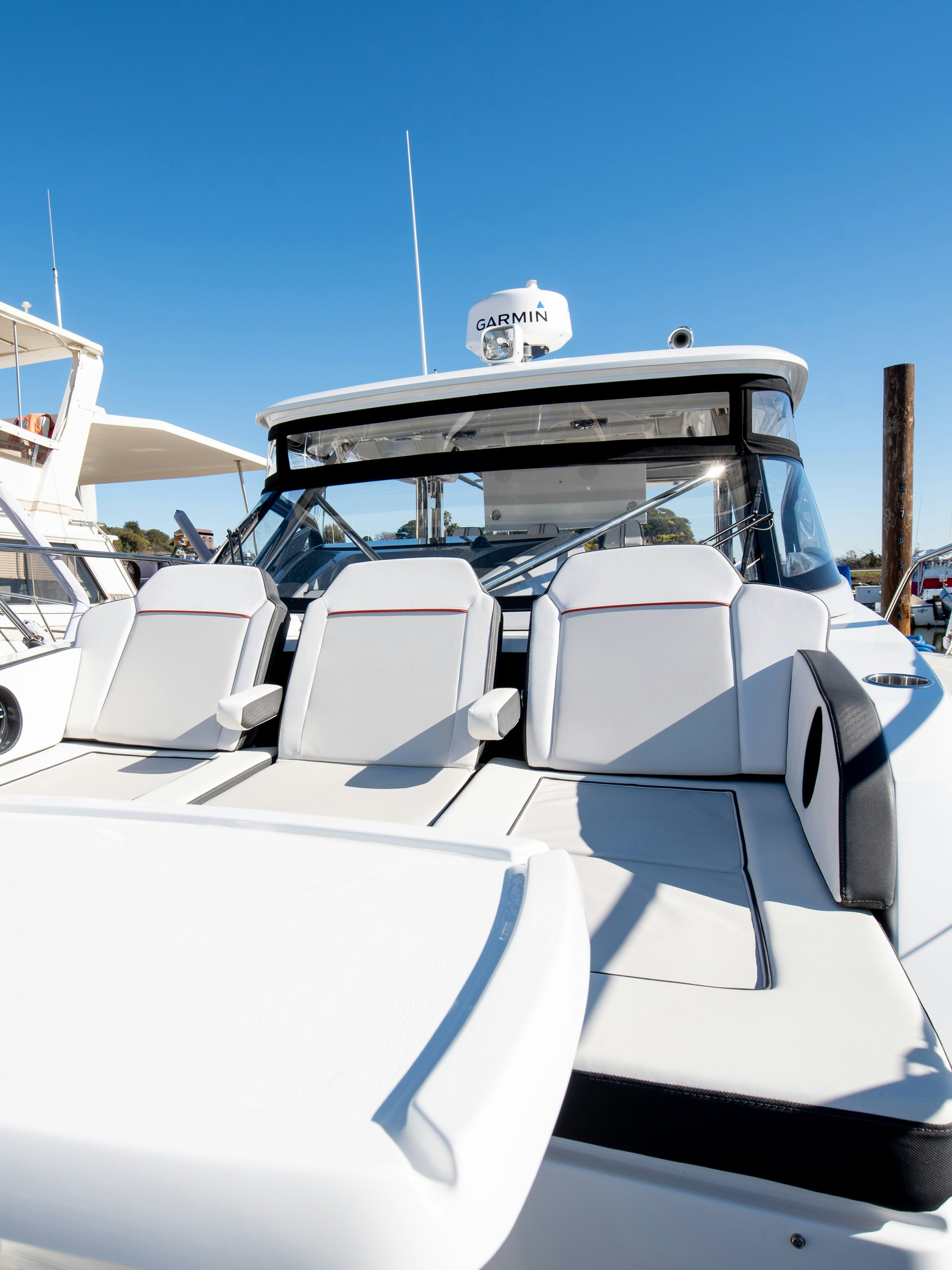 a row of white chairs on a boat aboard NAUTI BRIGI GULL Yacht for Sale