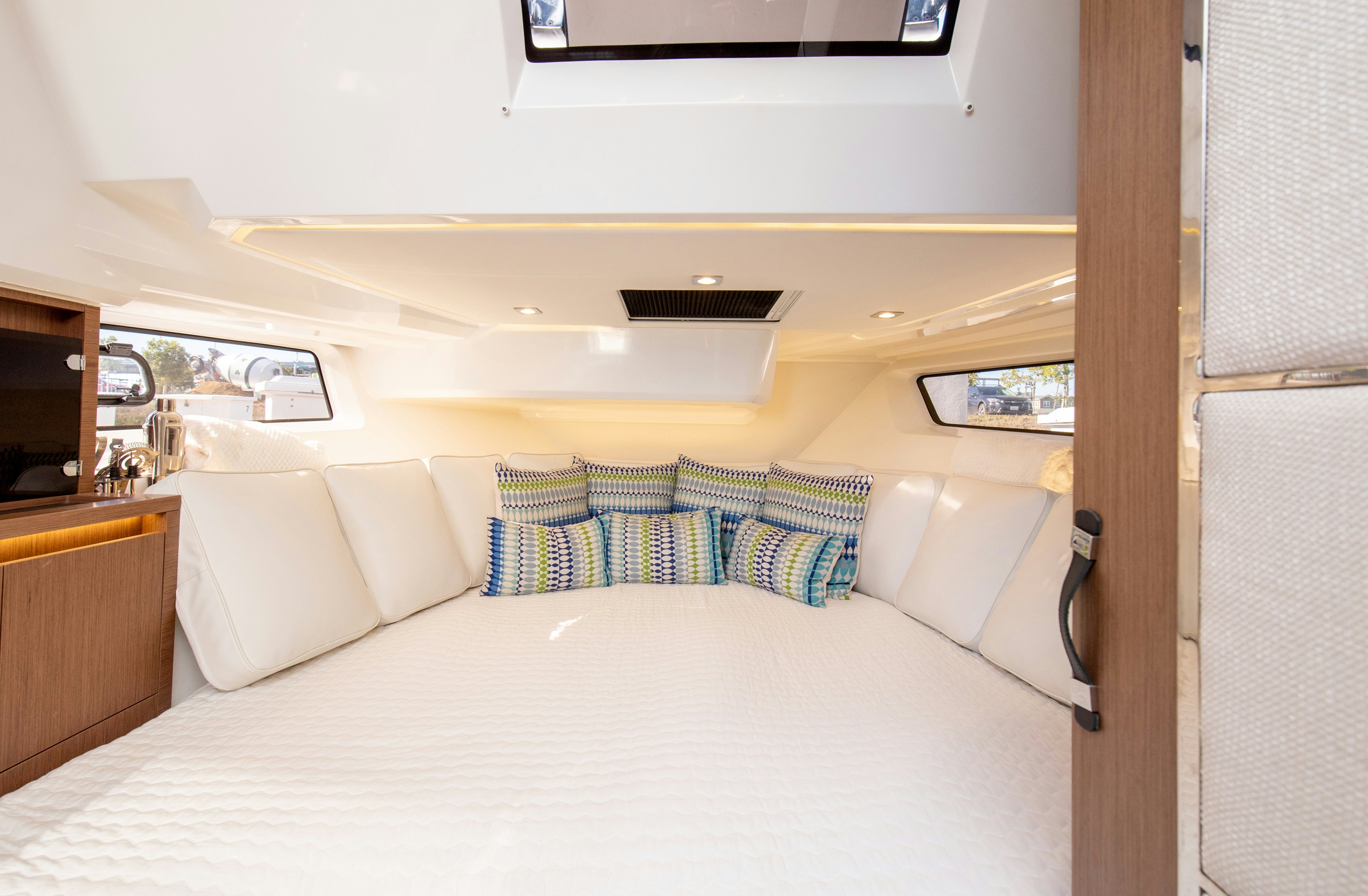 a bed with a white sheet and pillows aboard NAUTI BRIGI GULL Yacht for Sale