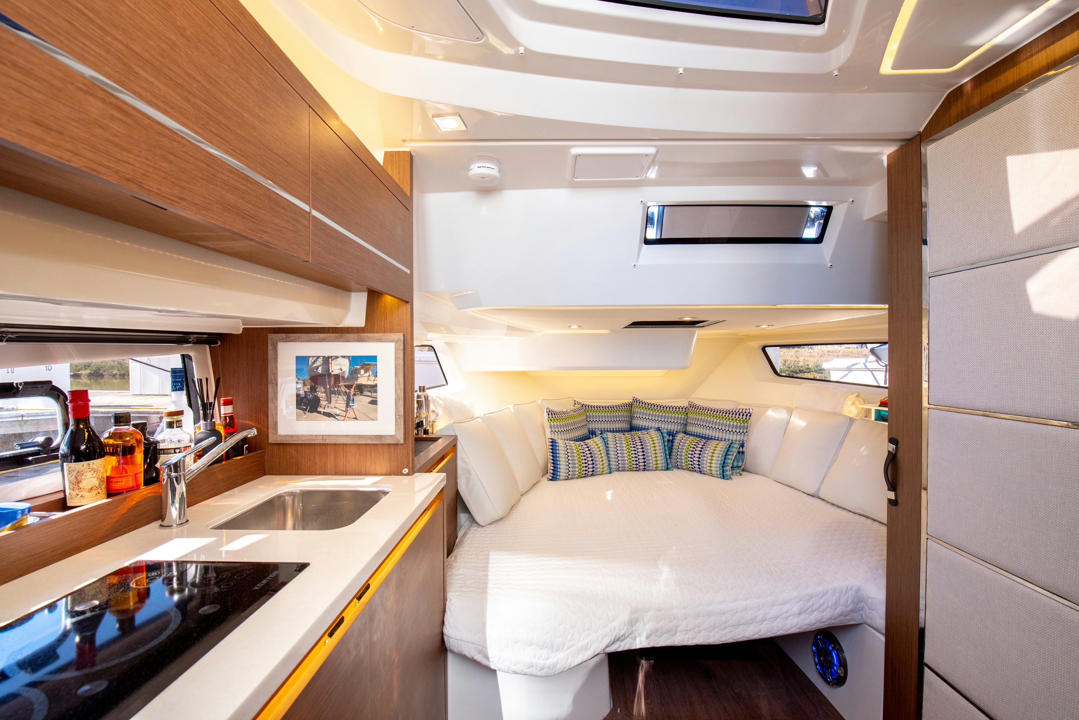a small kitchen with a couch aboard NAUTI BRIGI GULL Yacht for Sale