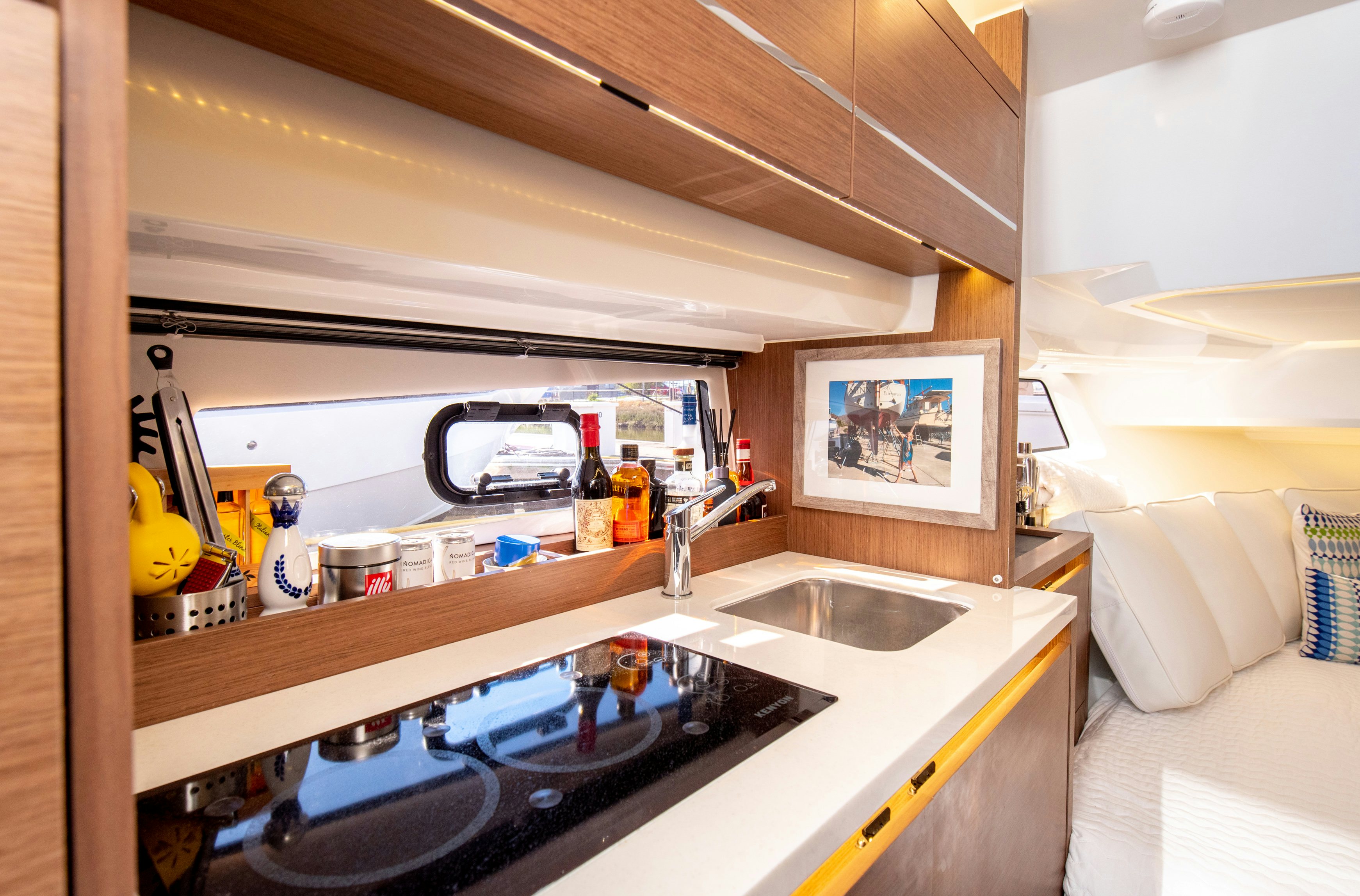 a kitchen with a sink and a microwave aboard NAUTI BRIGI GULL Yacht for Sale