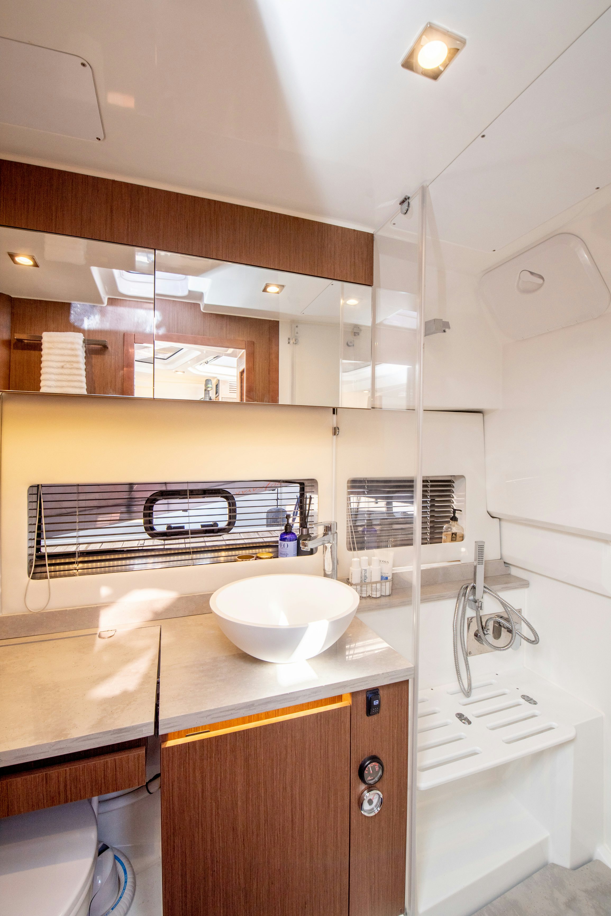 a bathroom with a sink and a mirror aboard NAUTI BRIGI GULL Yacht for Sale