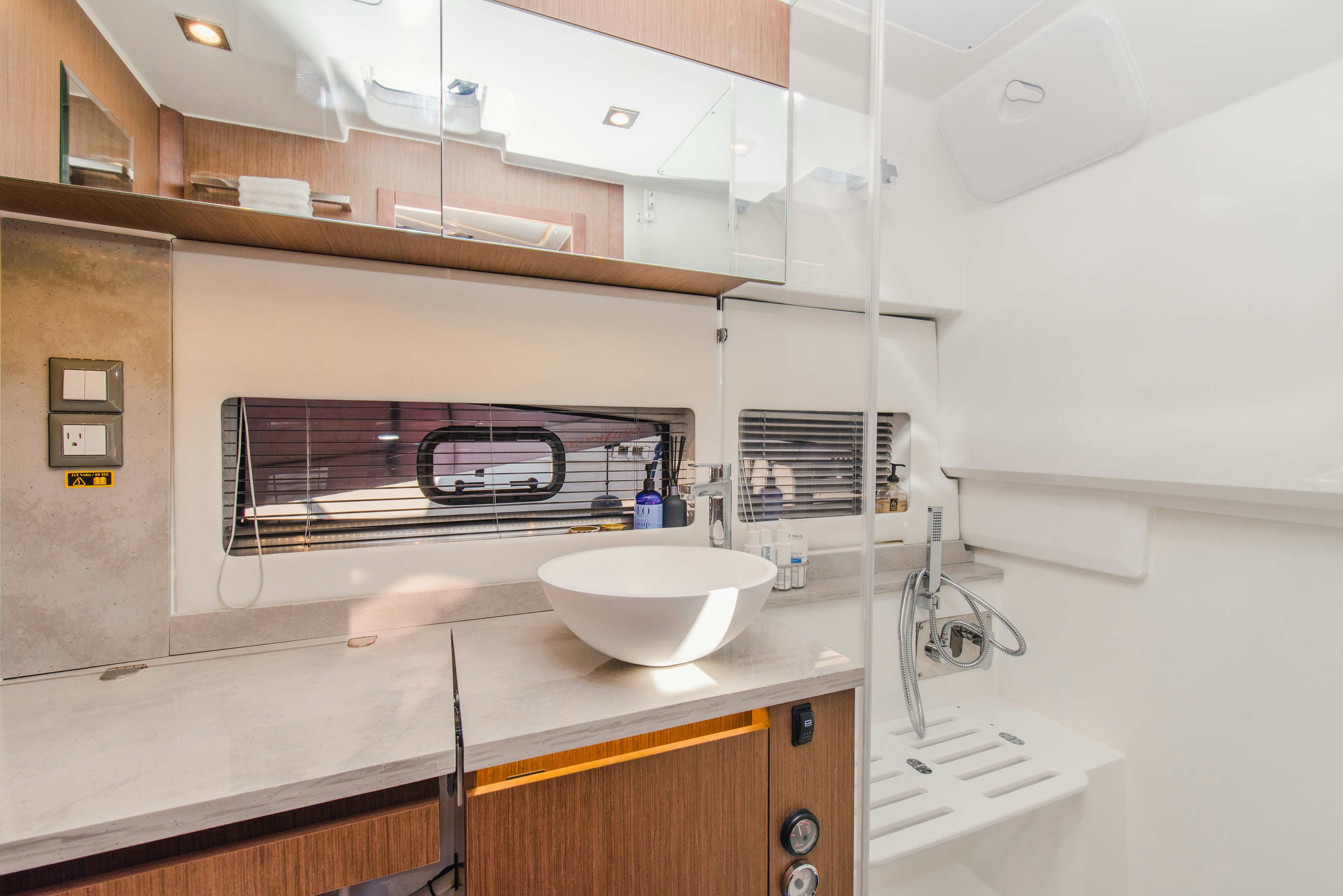 a sink and a microwave in a kitchen aboard NAUTI BRIGI GULL Yacht for Sale
