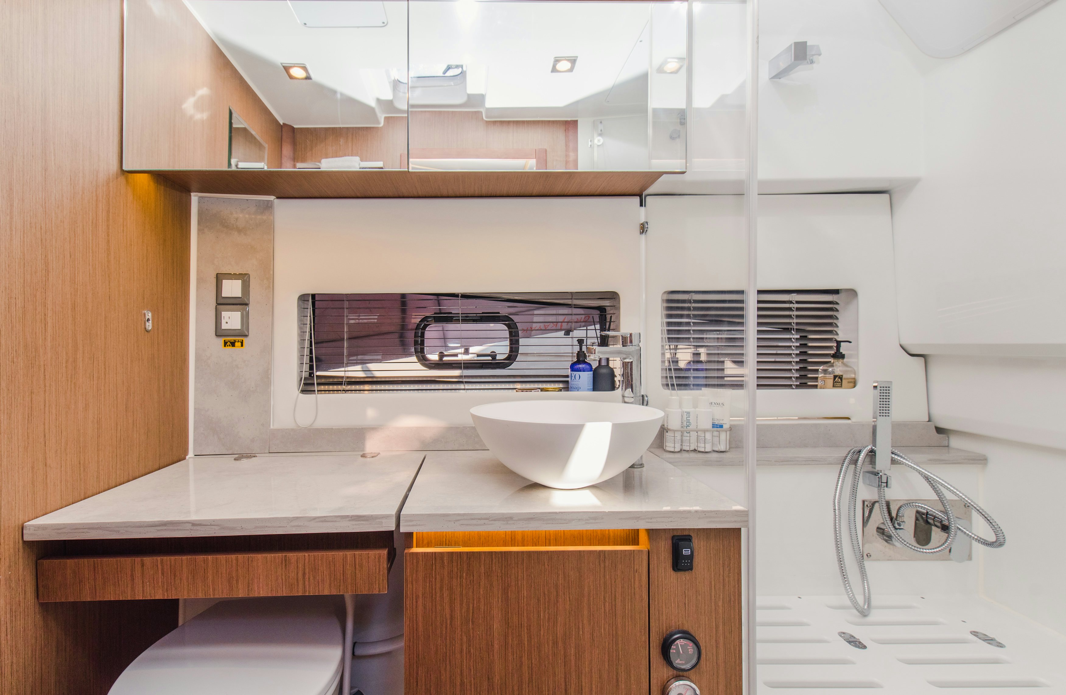 a kitchen with a sink and a microwave aboard NAUTI BRIGI GULL Yacht for Sale