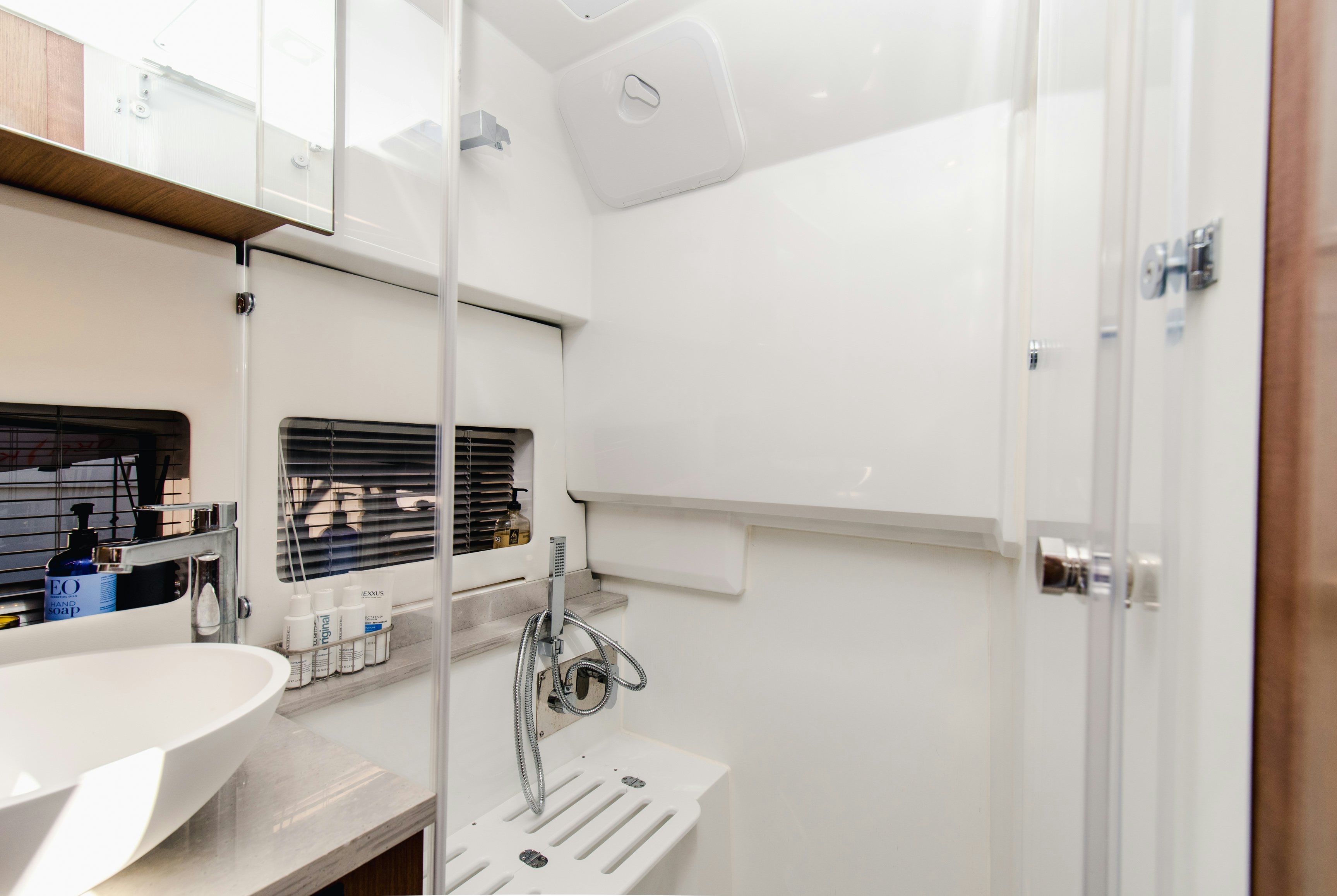 a bathroom with a sink and a mirror aboard NAUTI BRIGI GULL Yacht for Sale