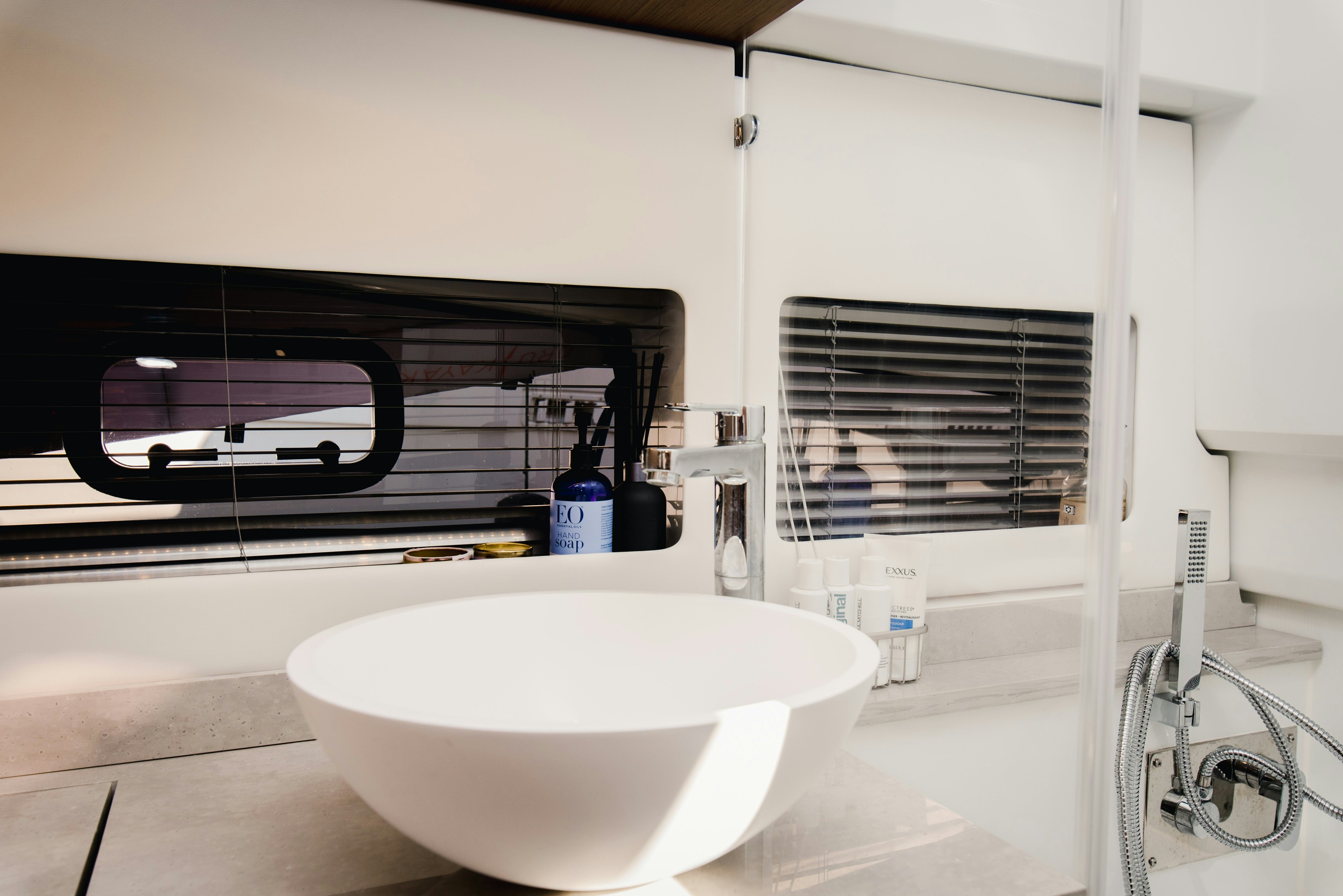 a sink and a mirror in a bathroom aboard NAUTI BRIGI GULL Yacht for Sale