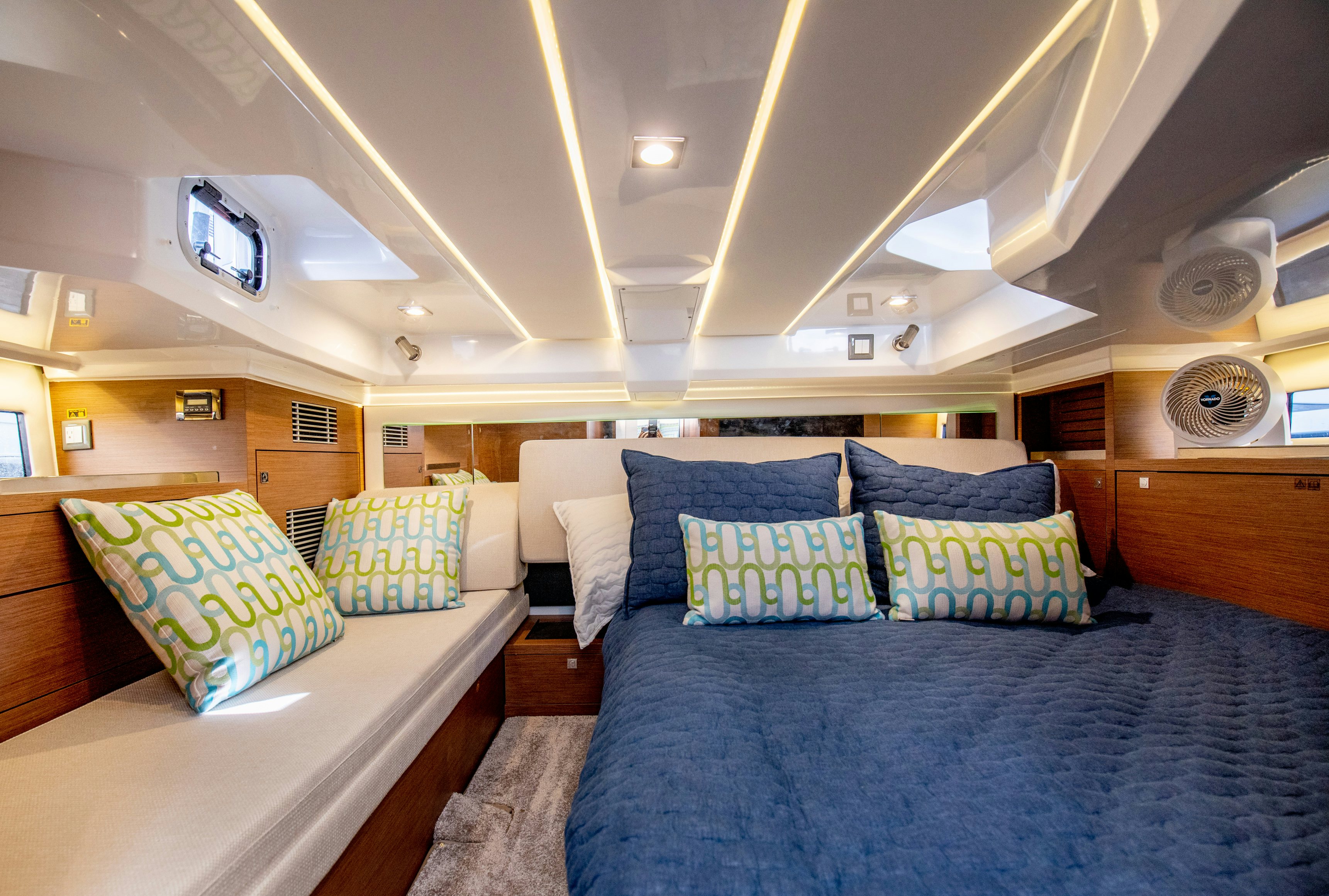 a room with a bed and a couch aboard NAUTI BRIGI GULL Yacht for Sale