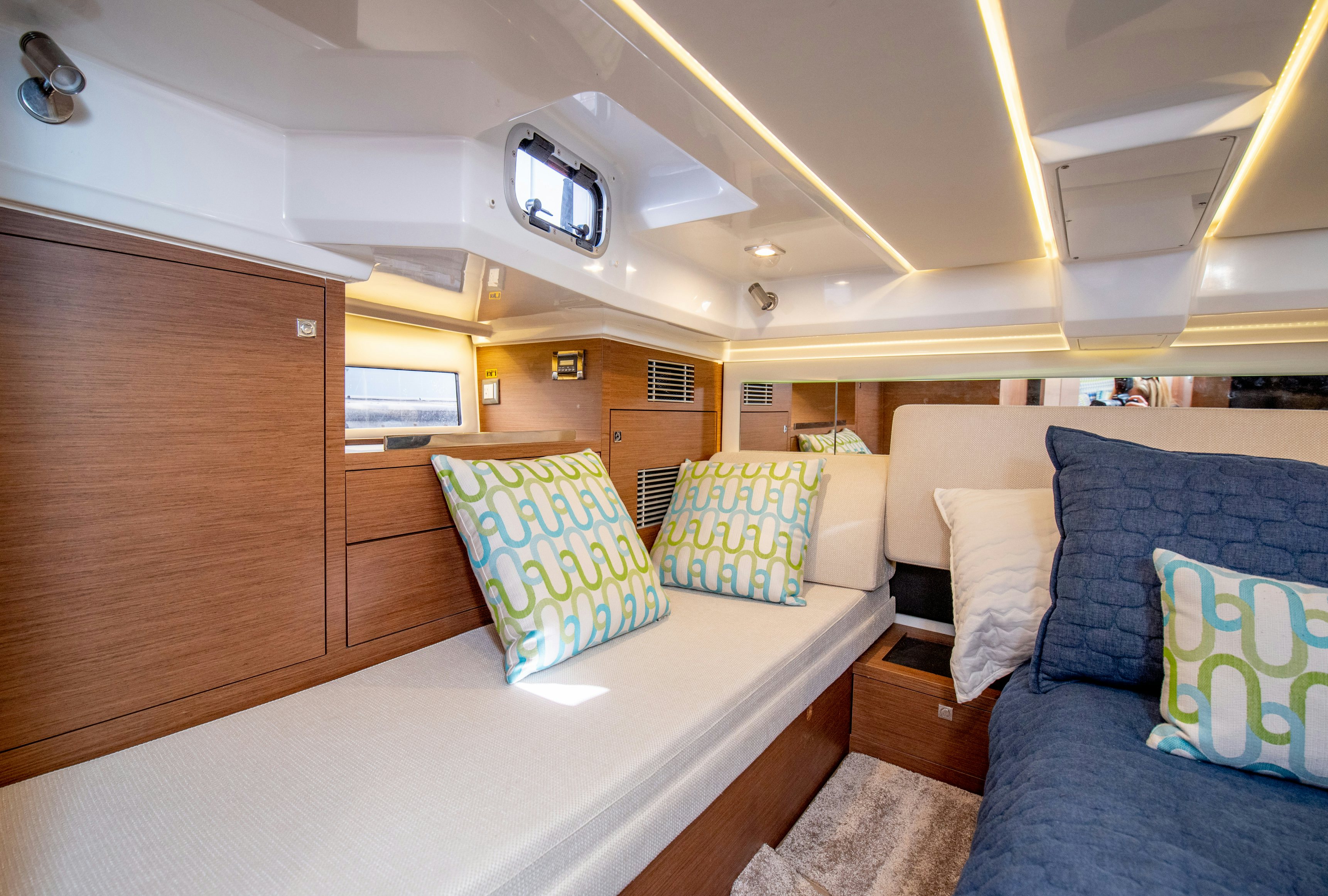 a room with a bed and a couch aboard NAUTI BRIGI GULL Yacht for Sale