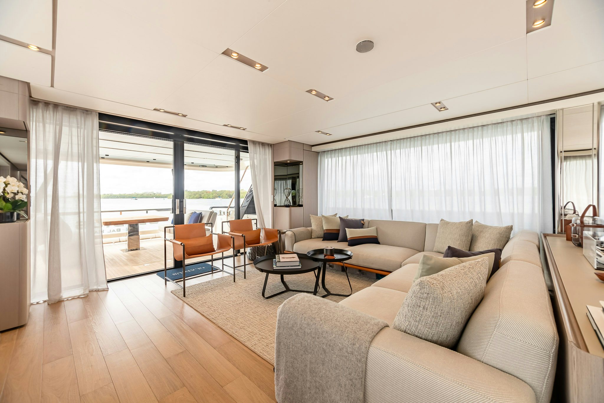 a living room with a large window aboard AURORA Yacht for Sale