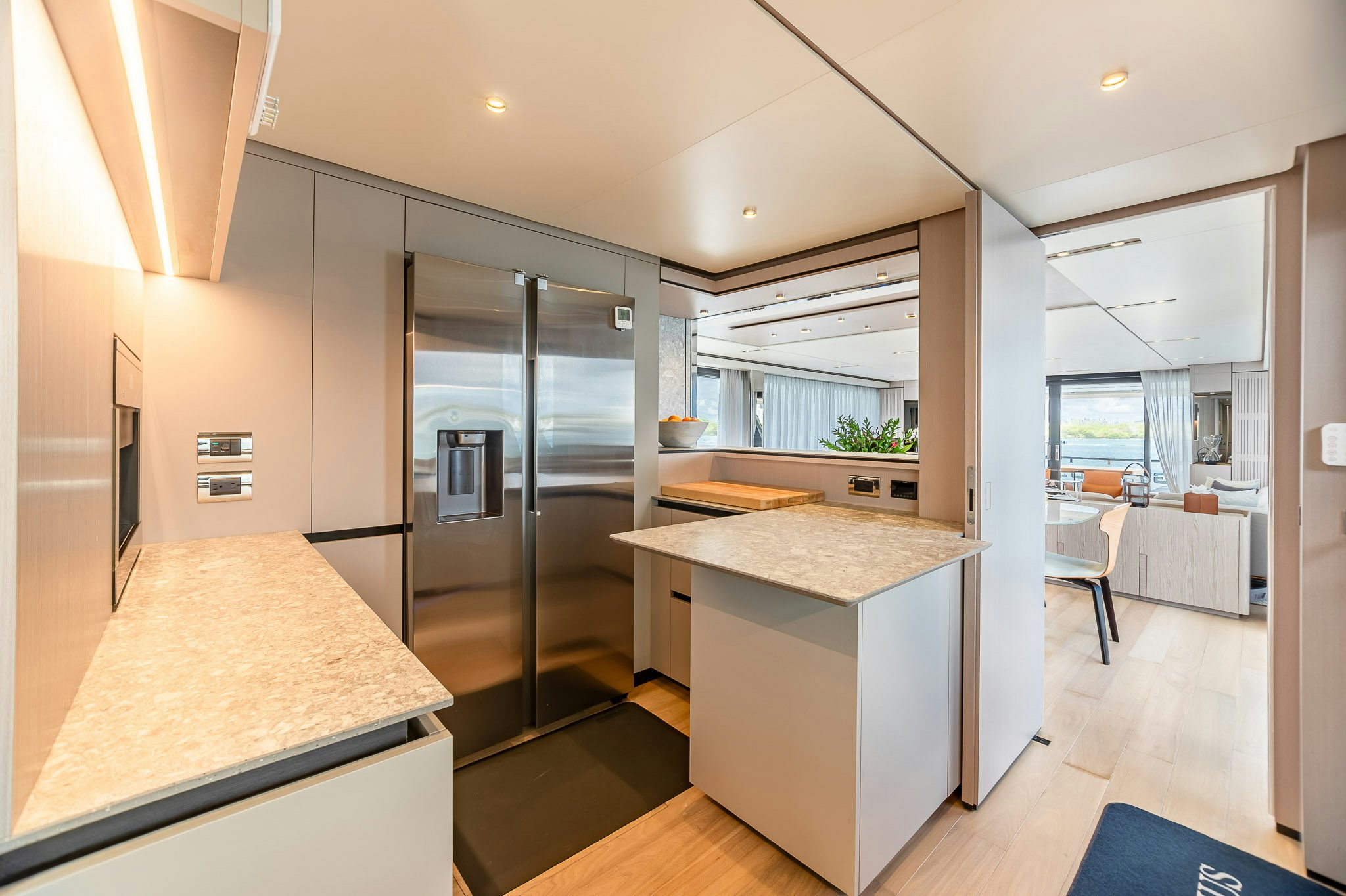 a kitchen with a glass door aboard AURORA Yacht for Sale