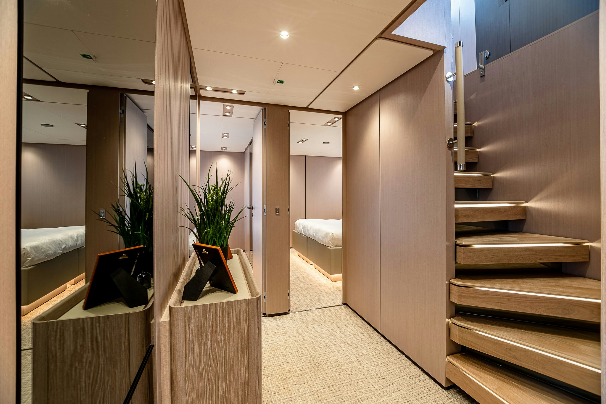 a hallway with a plant on the wall aboard AURORA Yacht for Sale