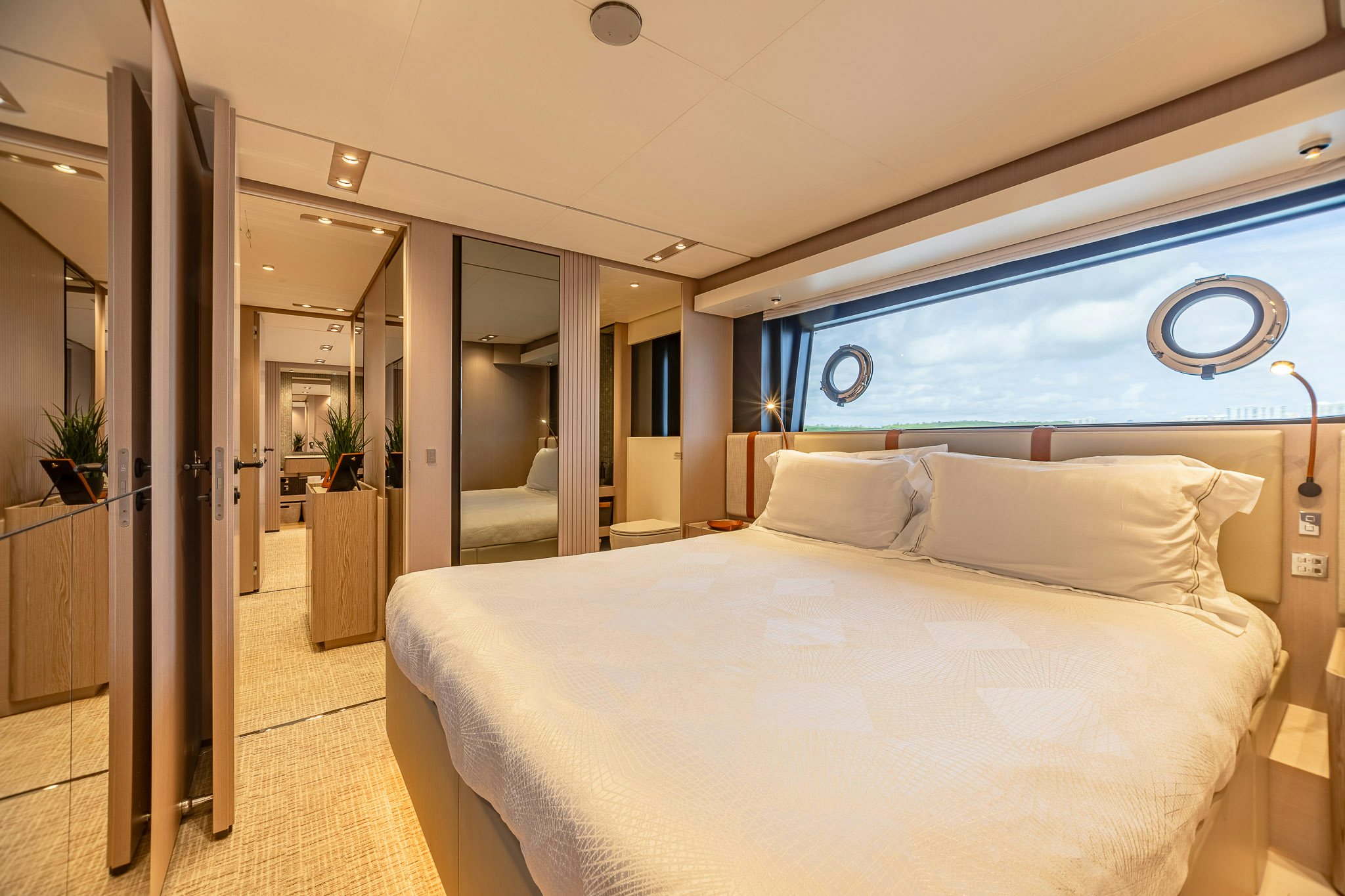 a large bed in a room aboard AURORA Yacht for Sale