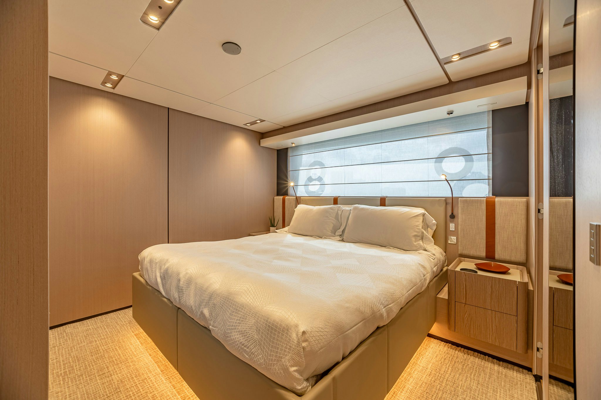 a bedroom with a large bed aboard AURORA Yacht for Sale