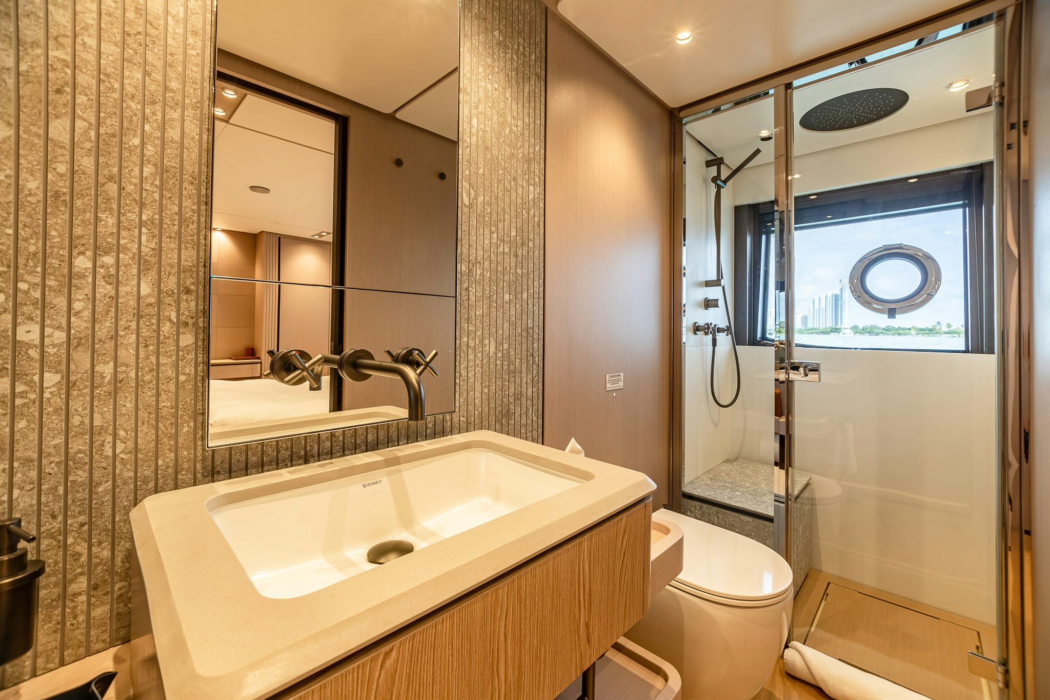 a bathroom with a sink and a shower aboard AURORA Yacht for Sale