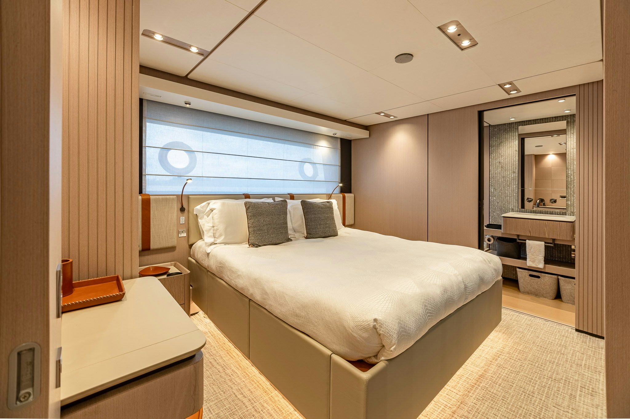 a room with a bed and a desk aboard AURORA Yacht for Sale
