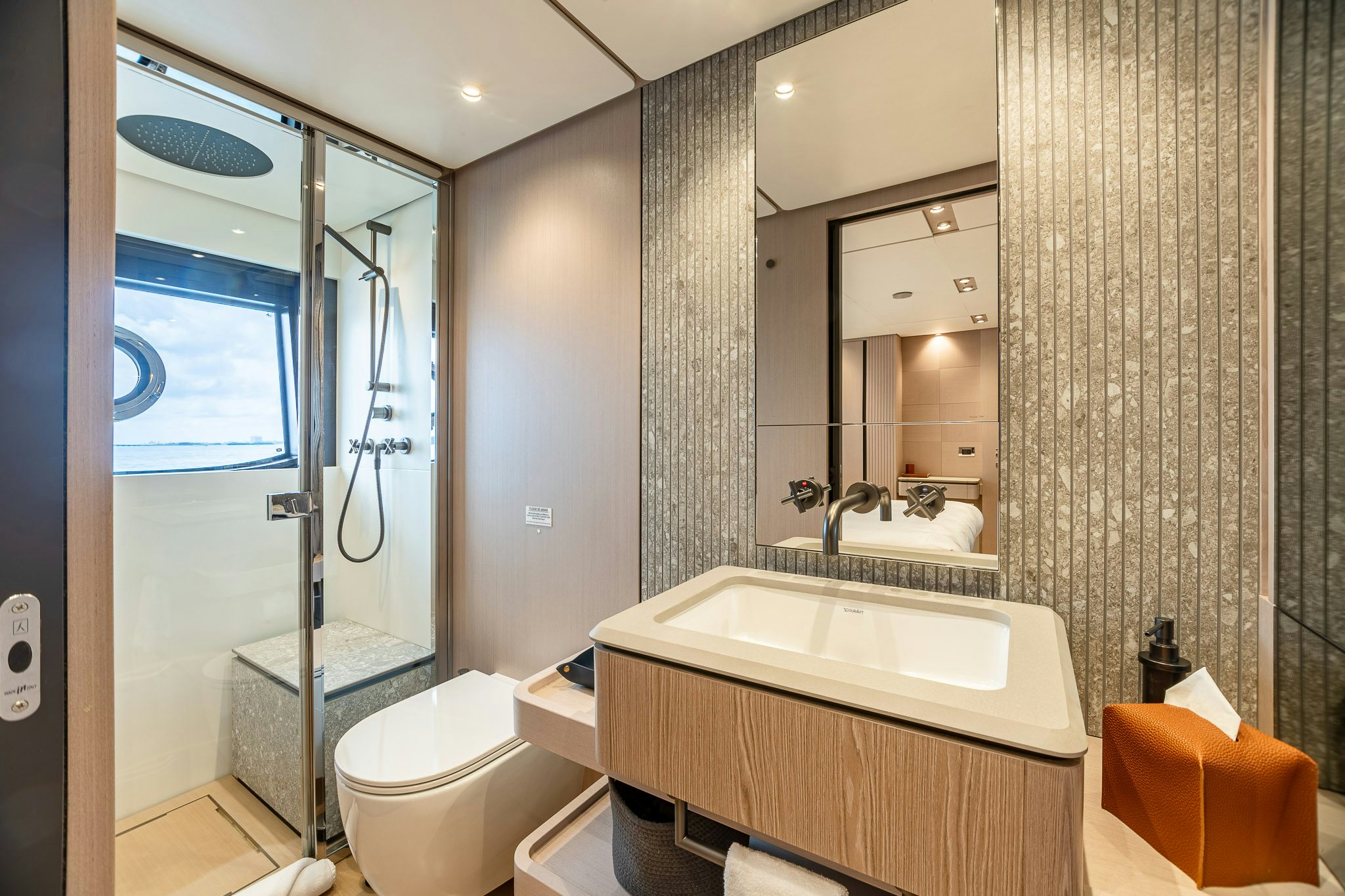 a bathroom with a bathtub and toilet aboard AURORA Yacht for Sale