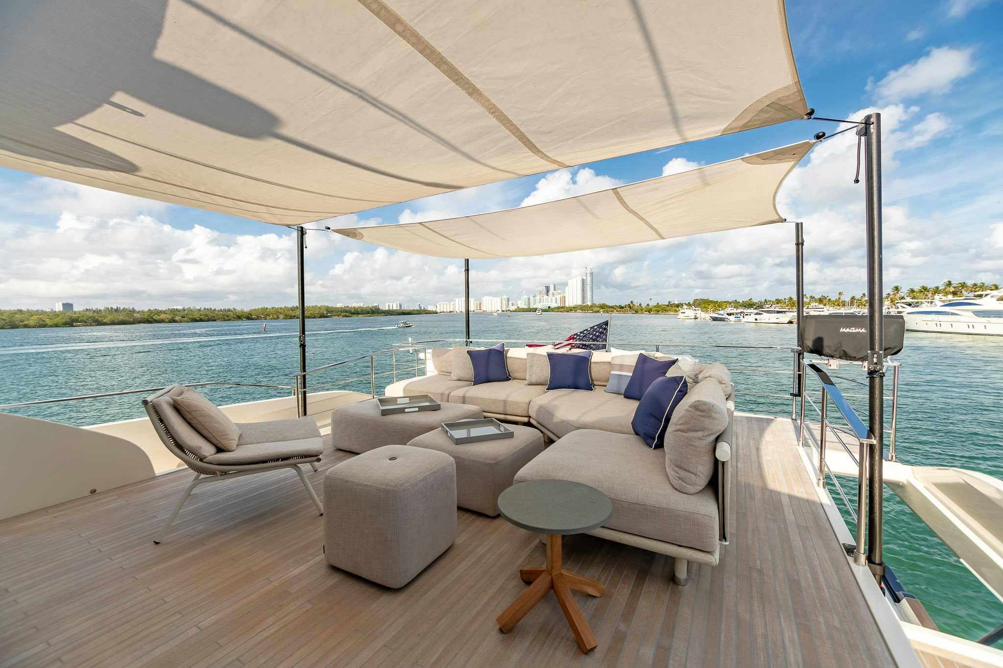 a deck with chairs and a large body of water aboard AURORA Yacht for Sale