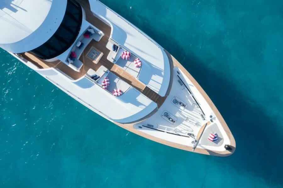 a plane flying over a city aboard NO BAD IDEAS Yacht for Sale