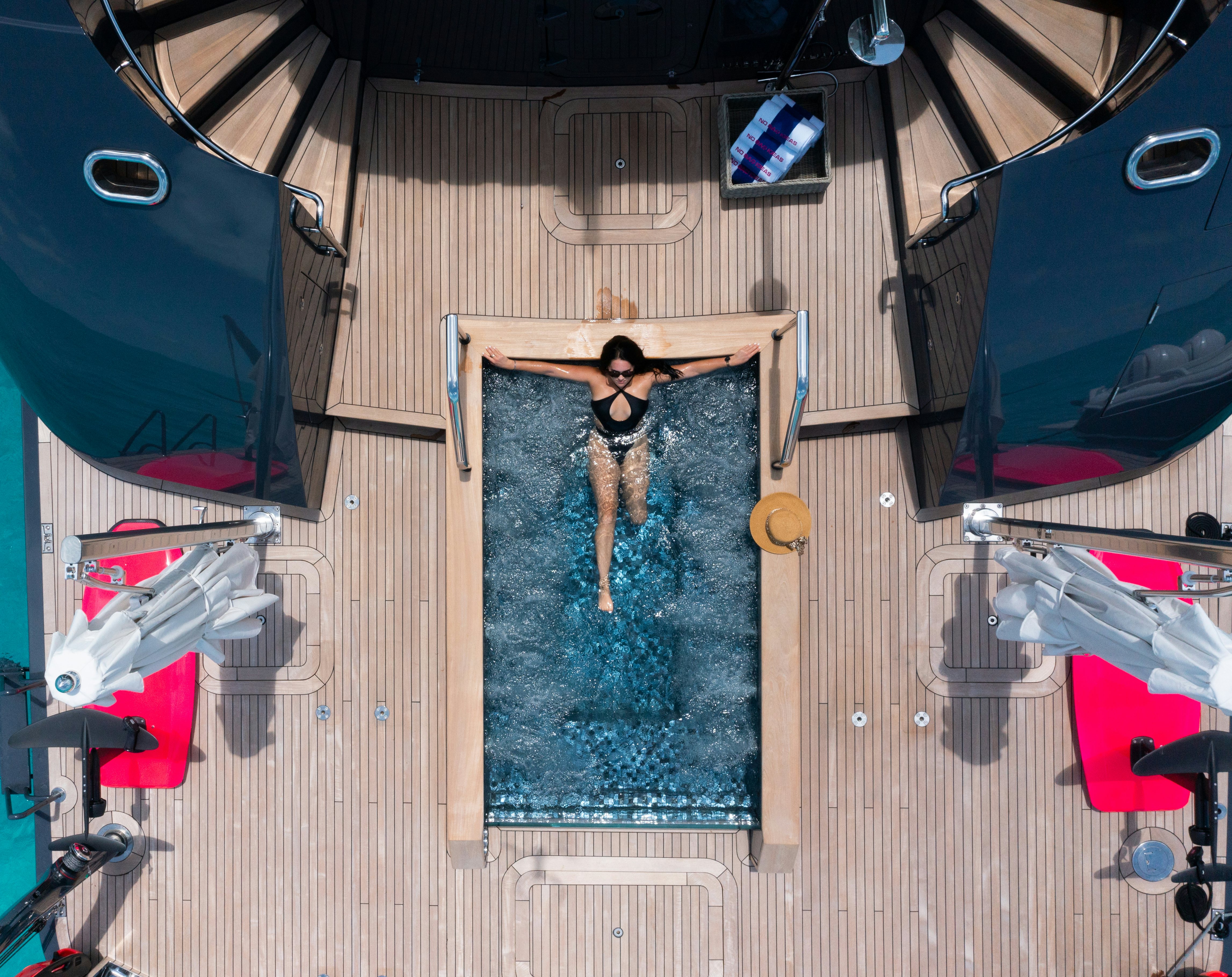 a person standing on a bed aboard NO BAD IDEAS Yacht for Sale