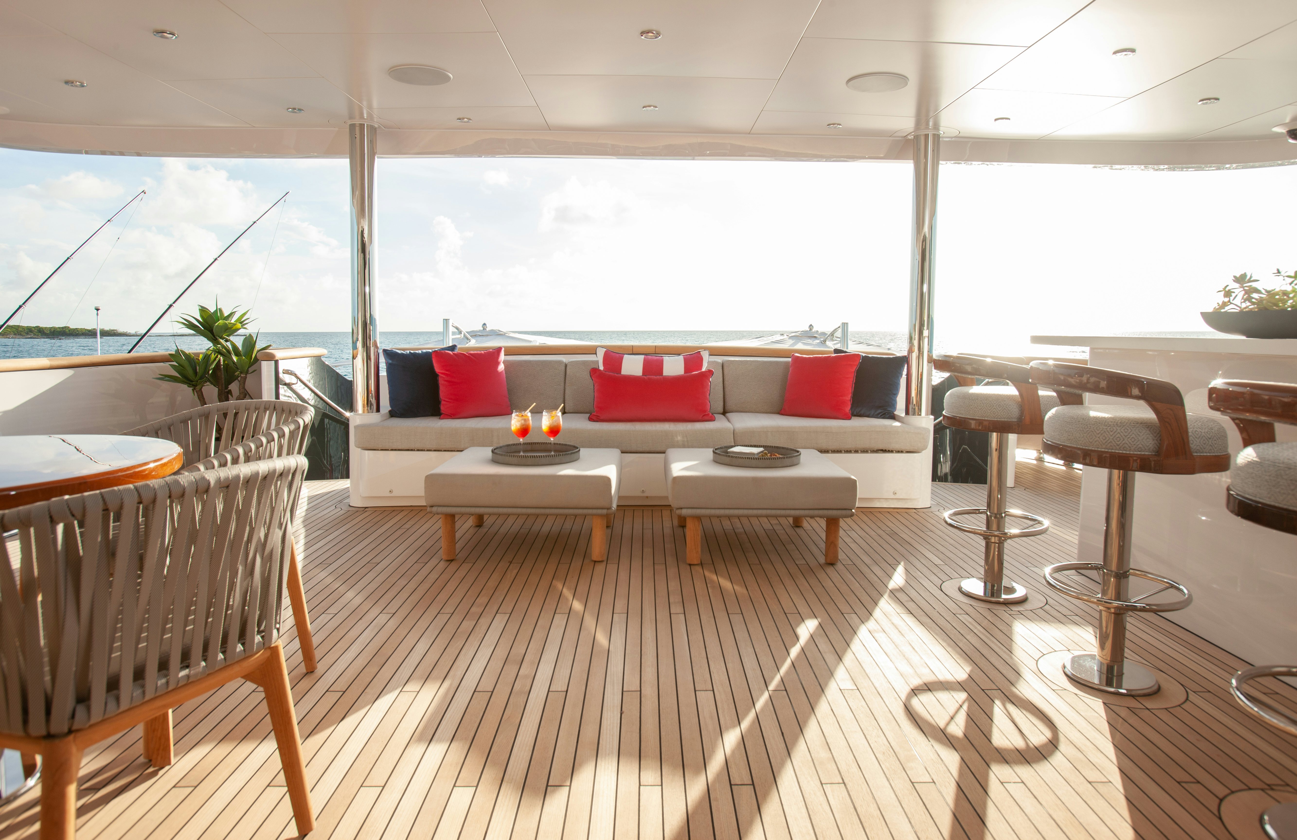 a room with a couch and tables aboard NO BAD IDEAS Yacht for Sale