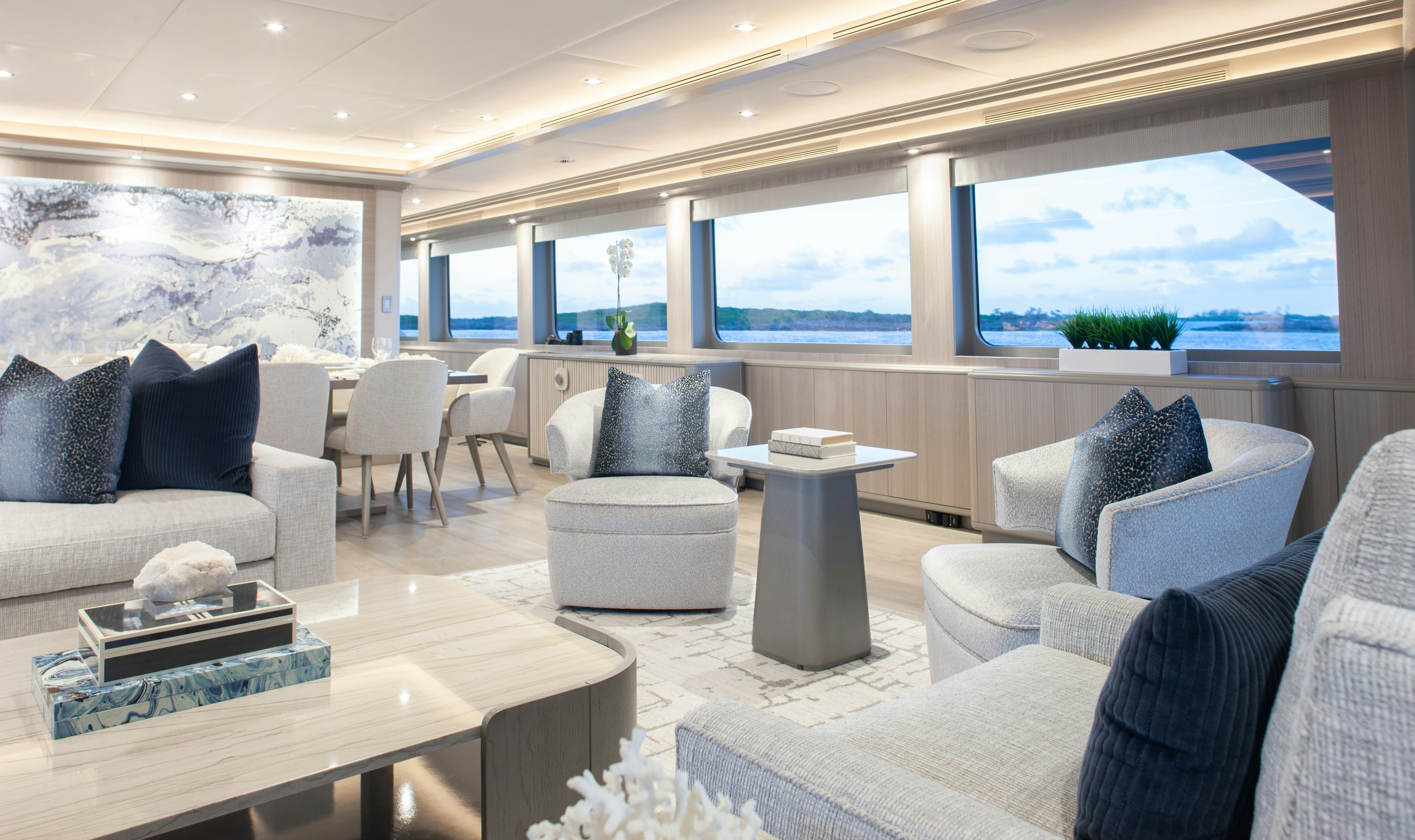 a living room with a large window aboard NO BAD IDEAS Yacht for Sale