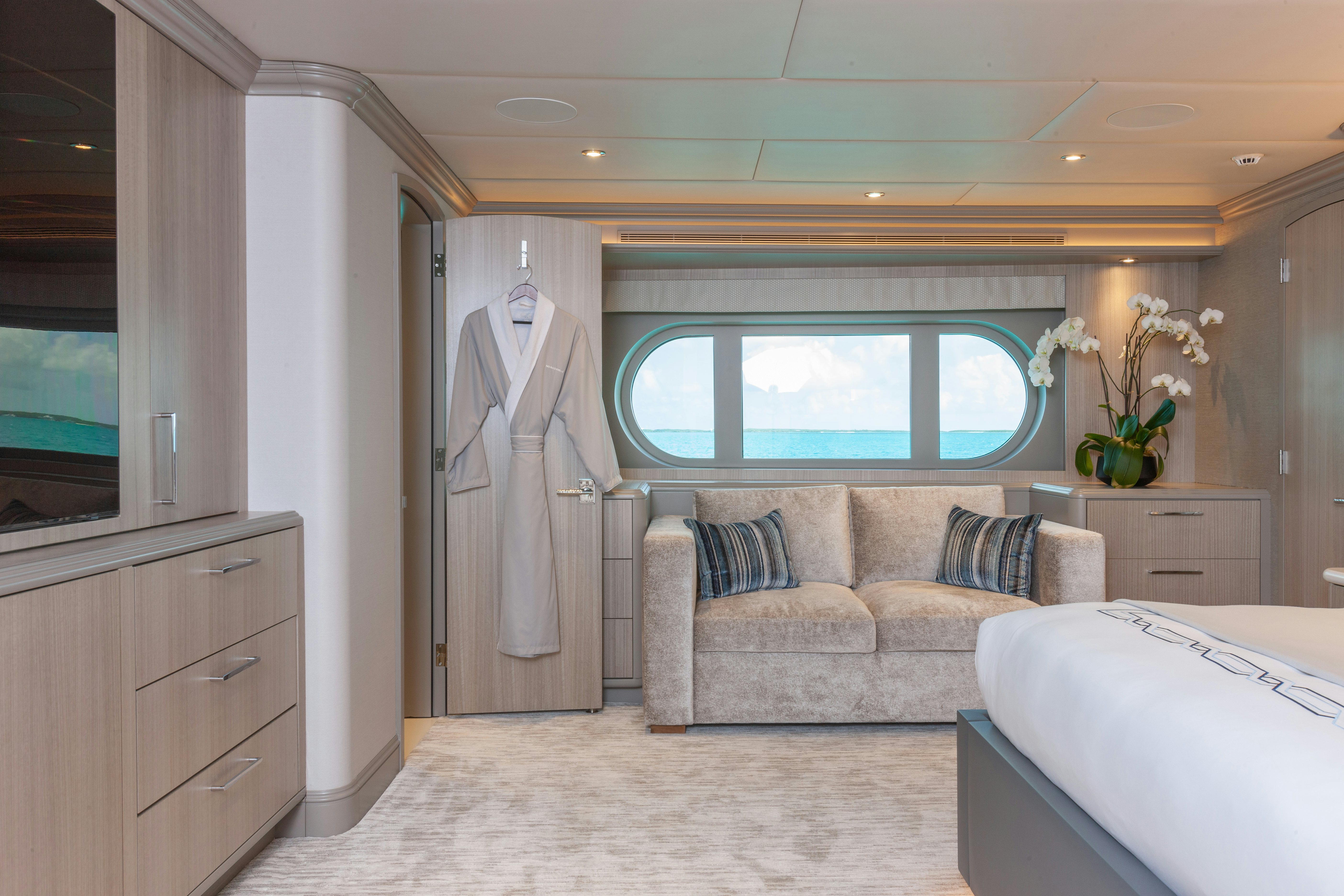 a living room with a couch and a window aboard NO BAD IDEAS Yacht for Sale