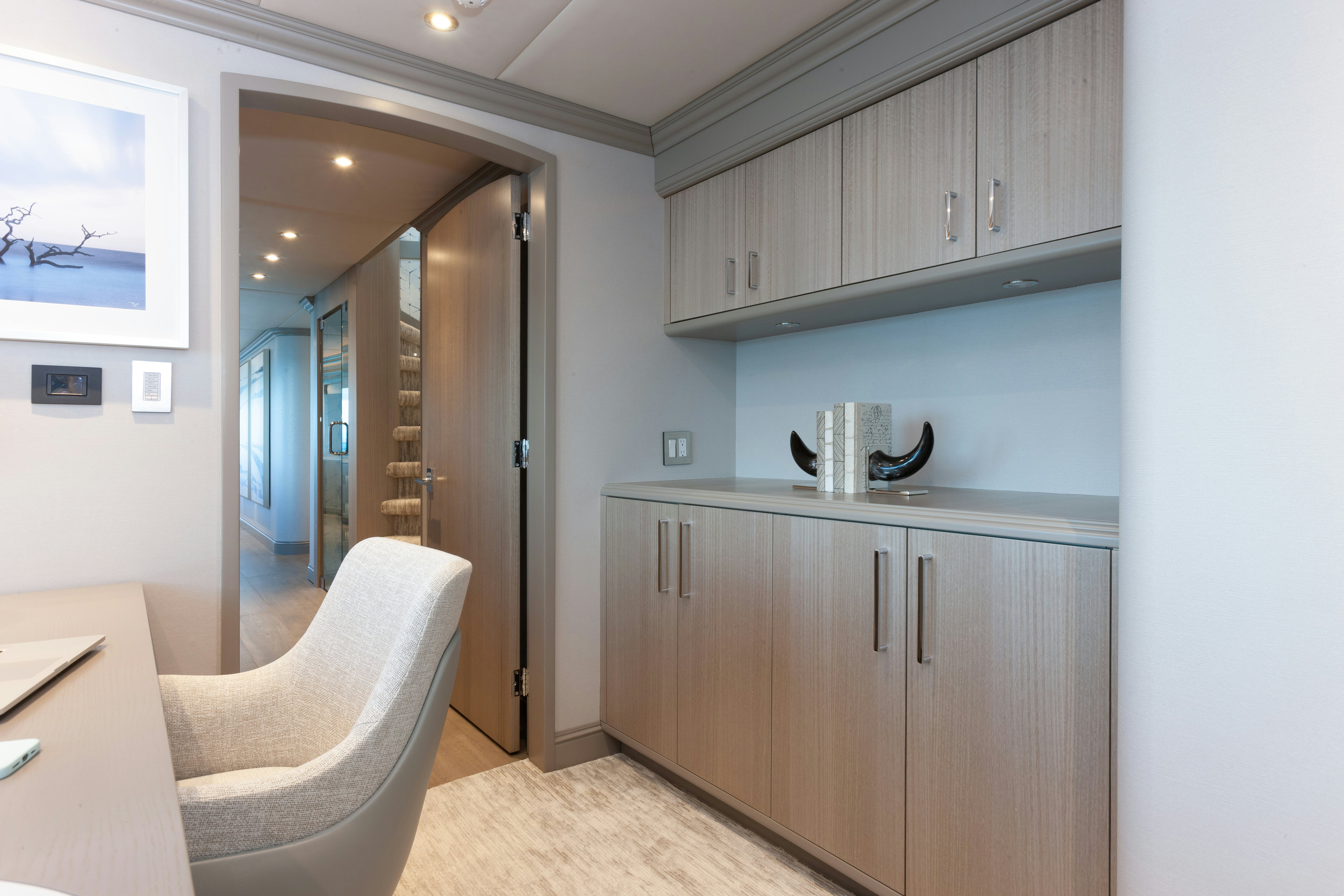 a kitchen with a white chair aboard NO BAD IDEAS Yacht for Sale
