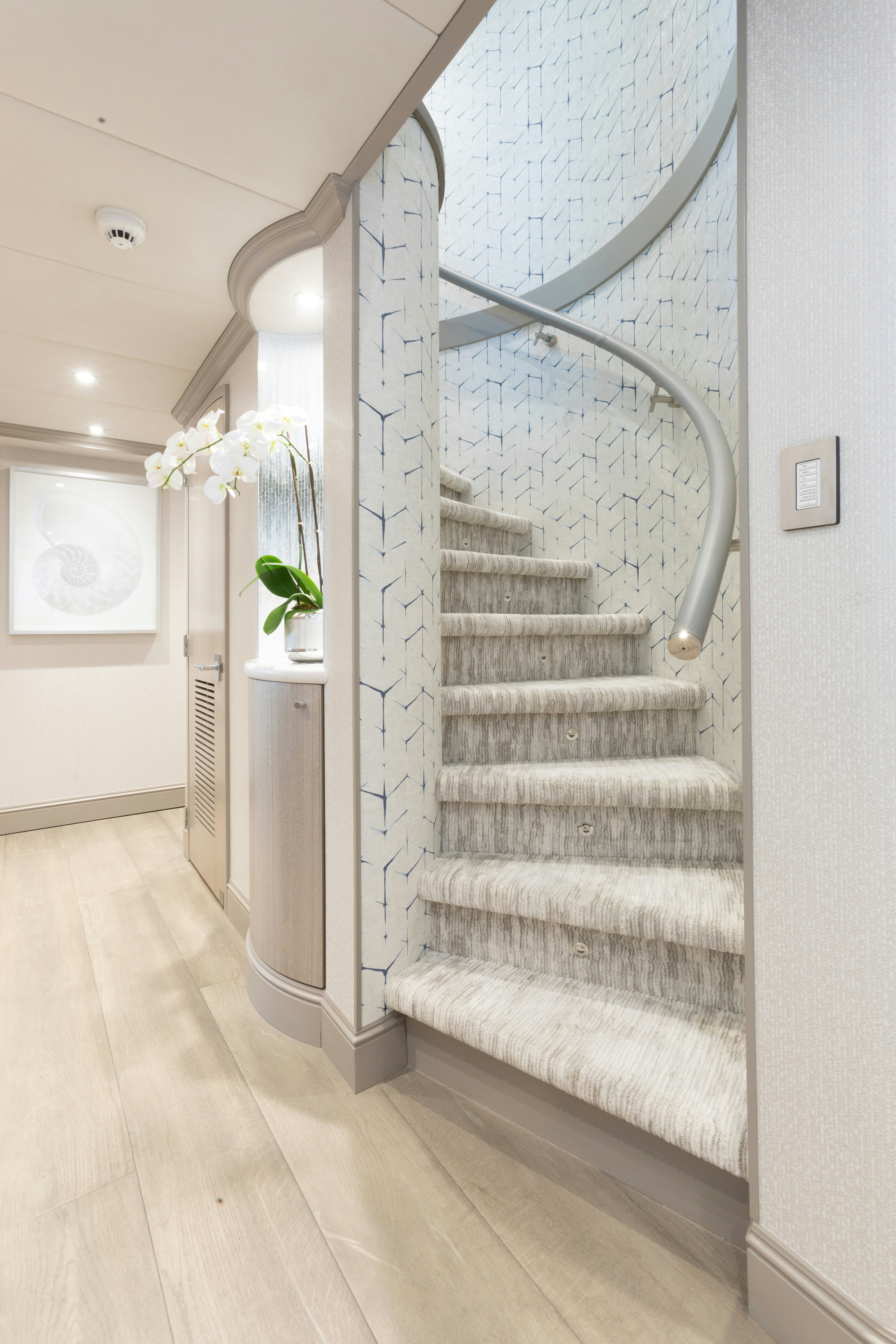 a staircase with white walls aboard NO BAD IDEAS Yacht for Sale