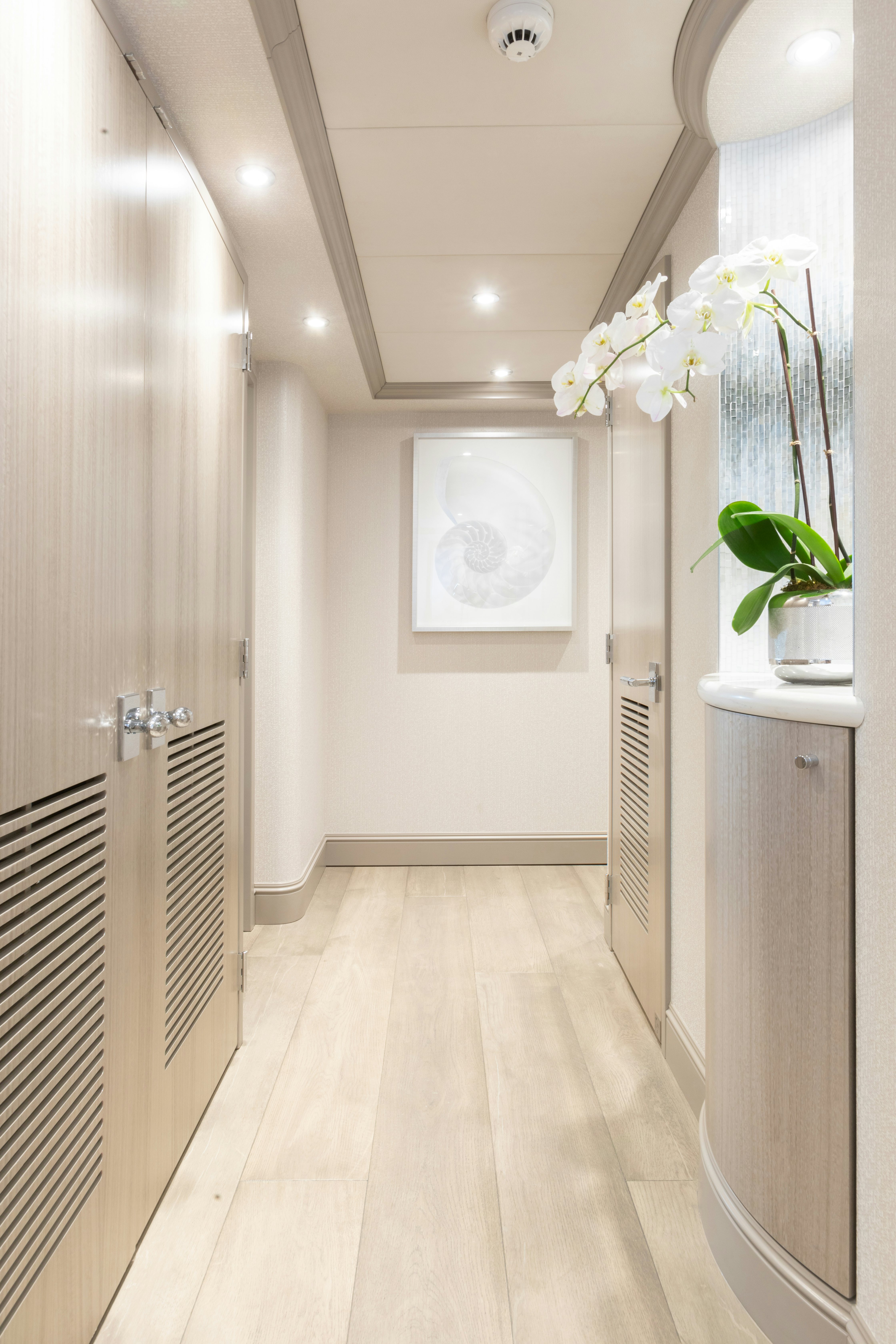 a hallway with white walls aboard NO BAD IDEAS Yacht for Sale