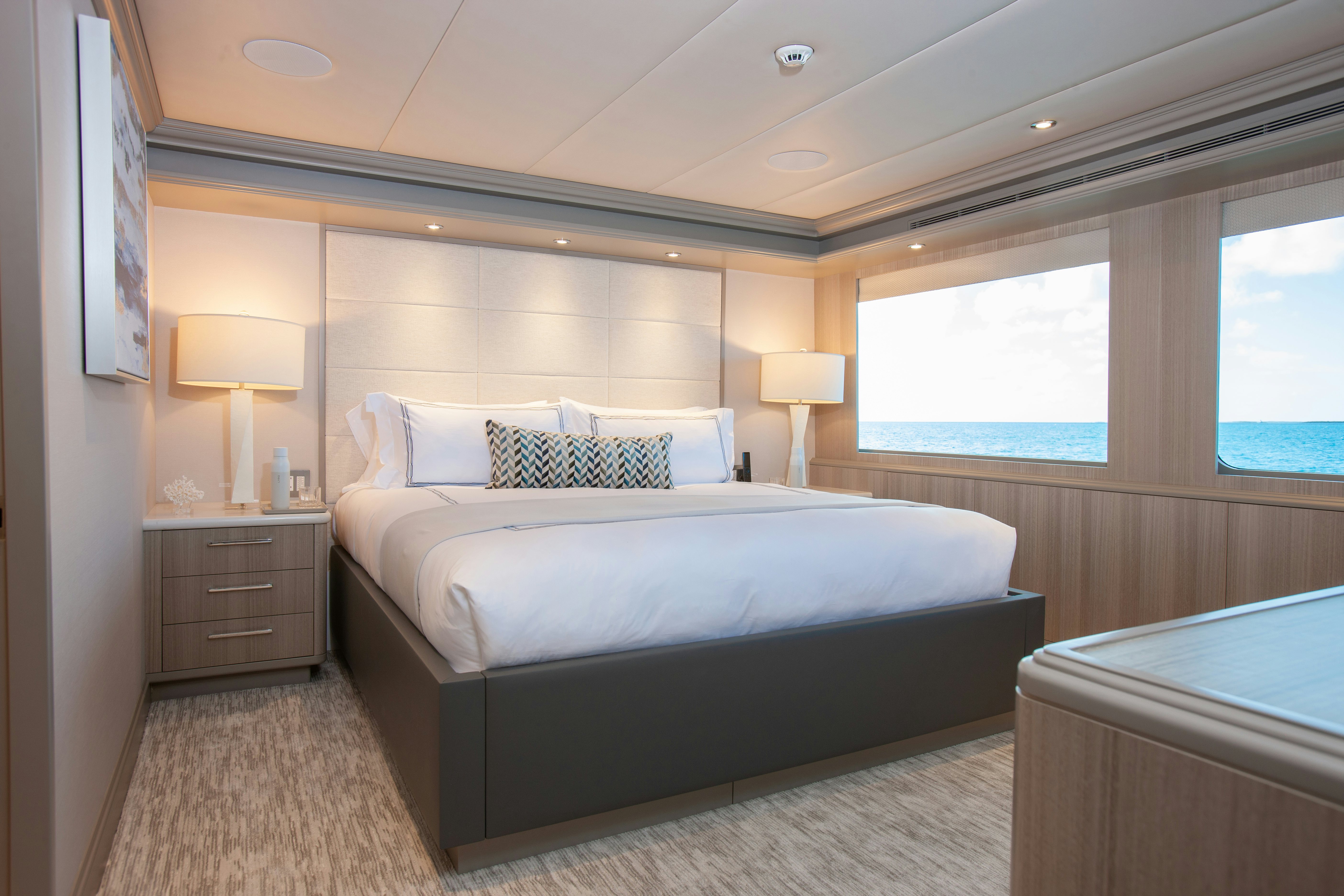 a bedroom with a large bed aboard NO BAD IDEAS Yacht for Sale