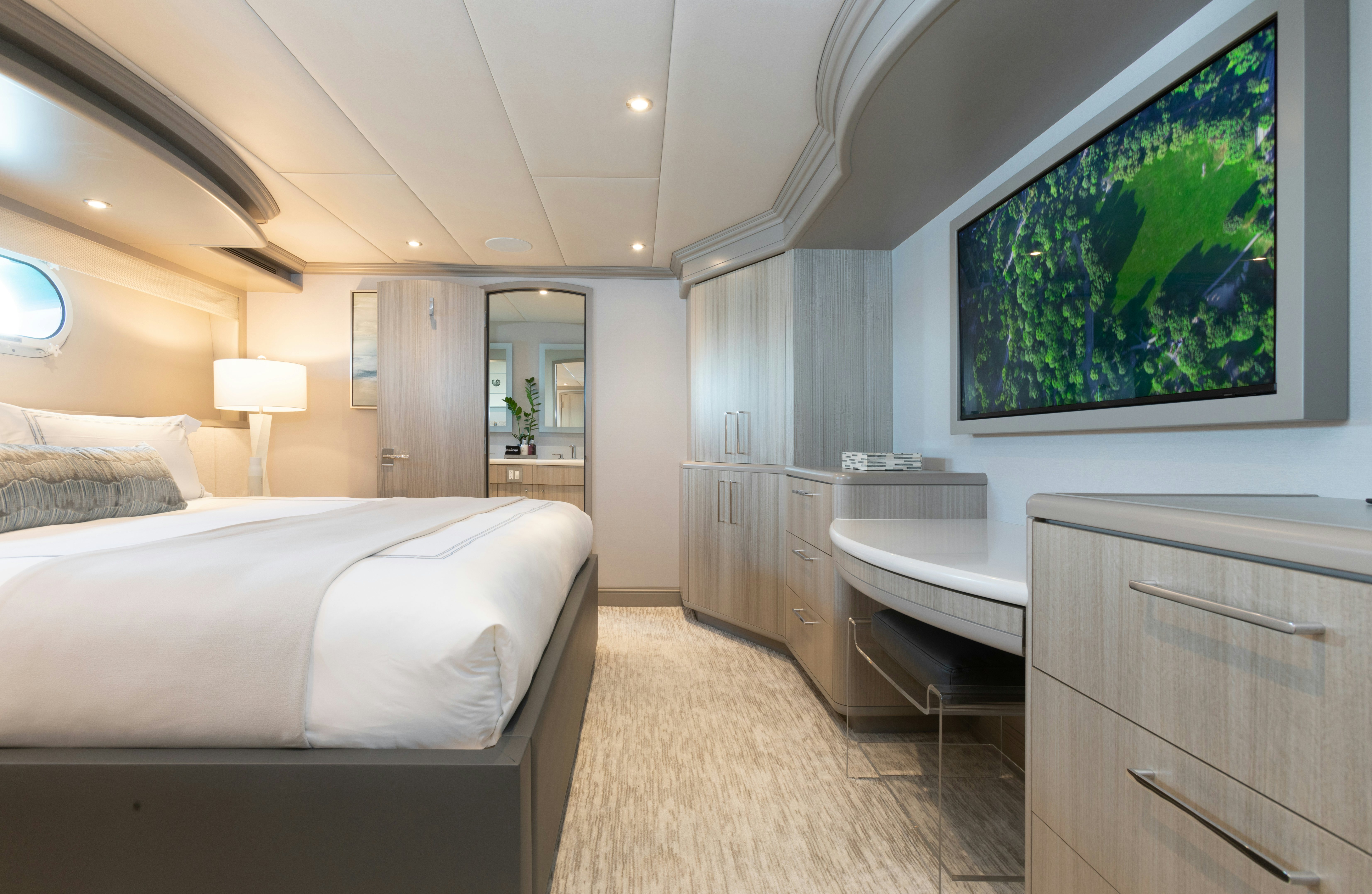 a bedroom with a large screen aboard NO BAD IDEAS Yacht for Sale