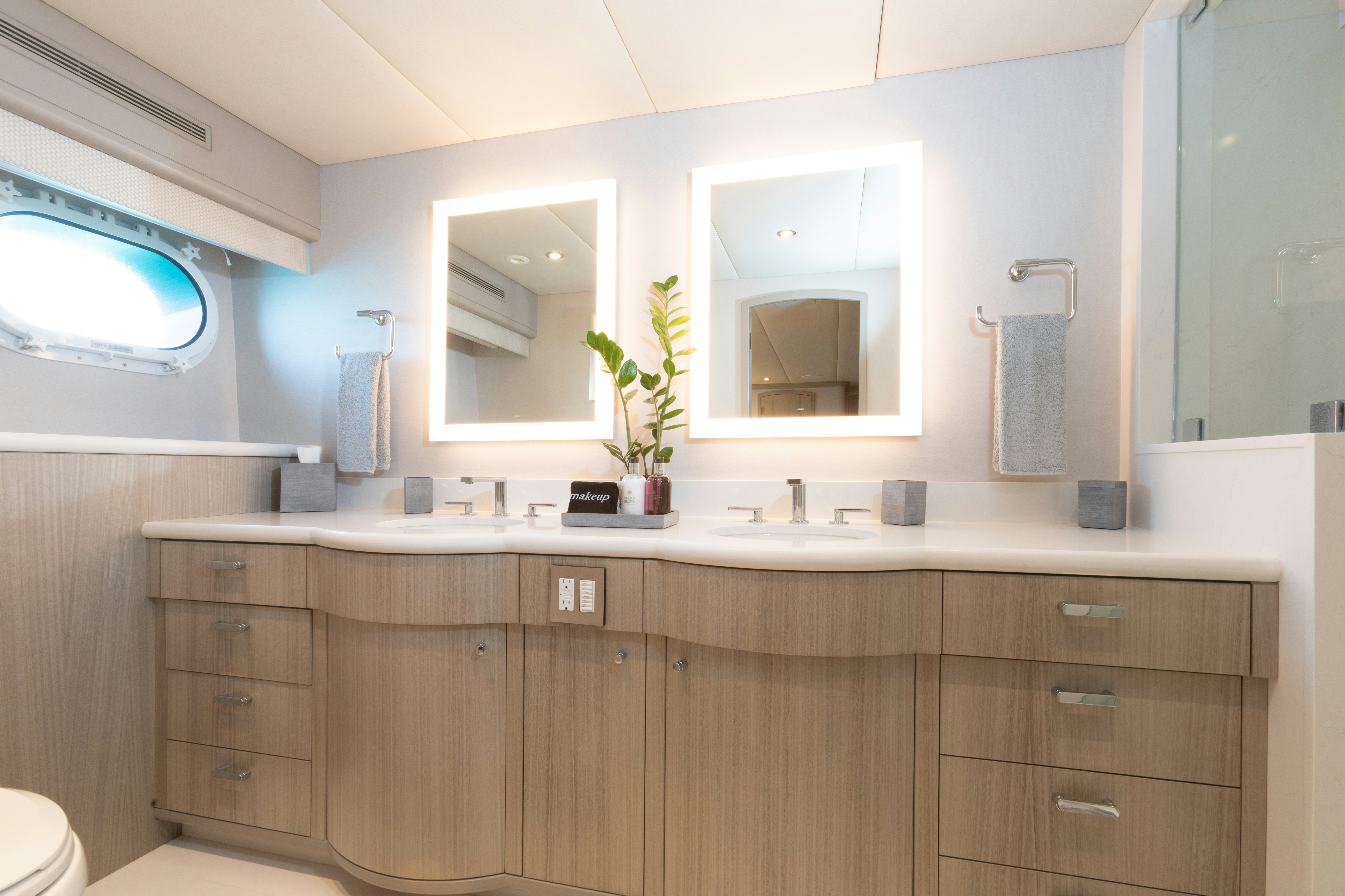 a bathroom with a sink and cabinets aboard NO BAD IDEAS Yacht for Sale