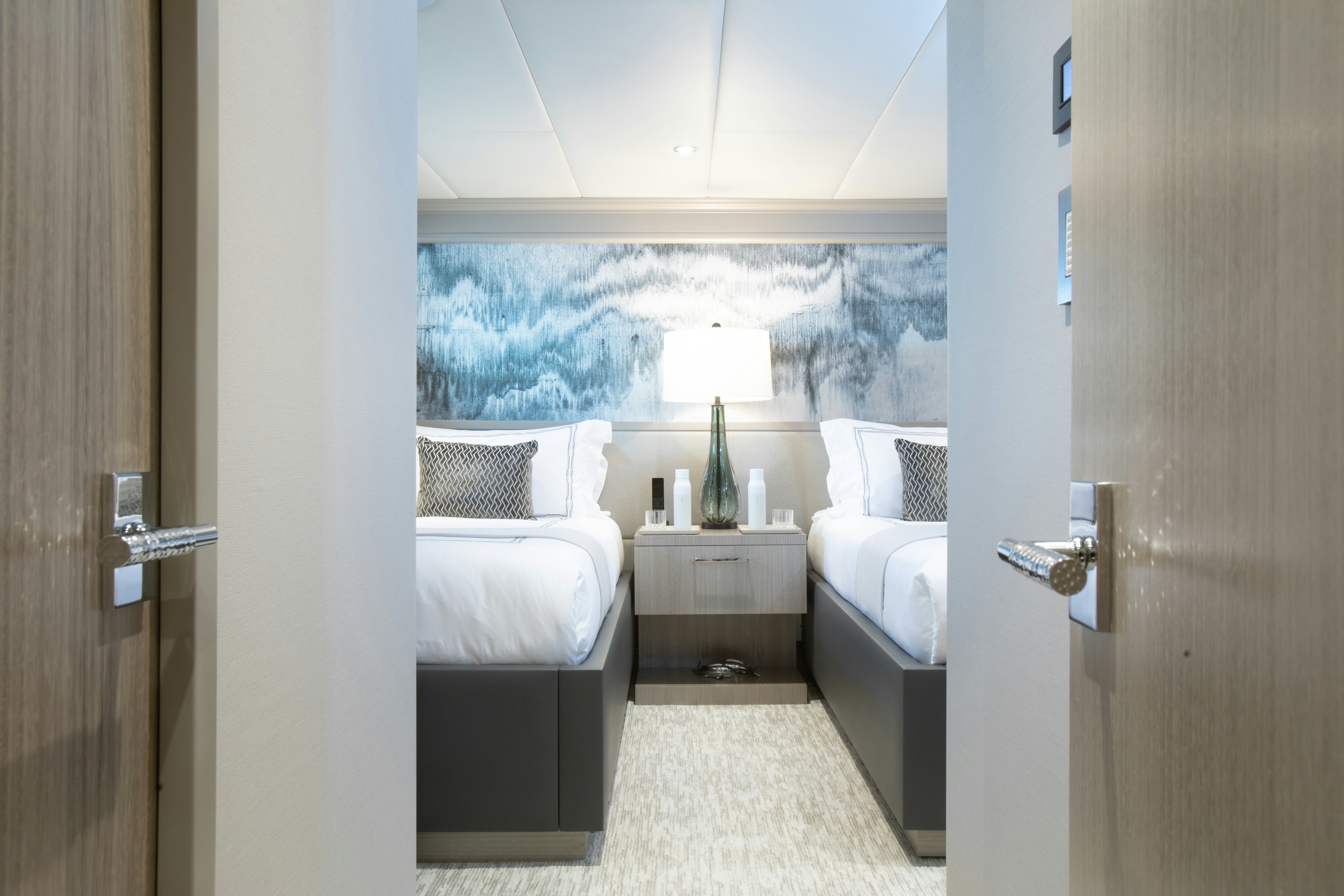 a room with a bed and a window aboard NO BAD IDEAS Yacht for Sale