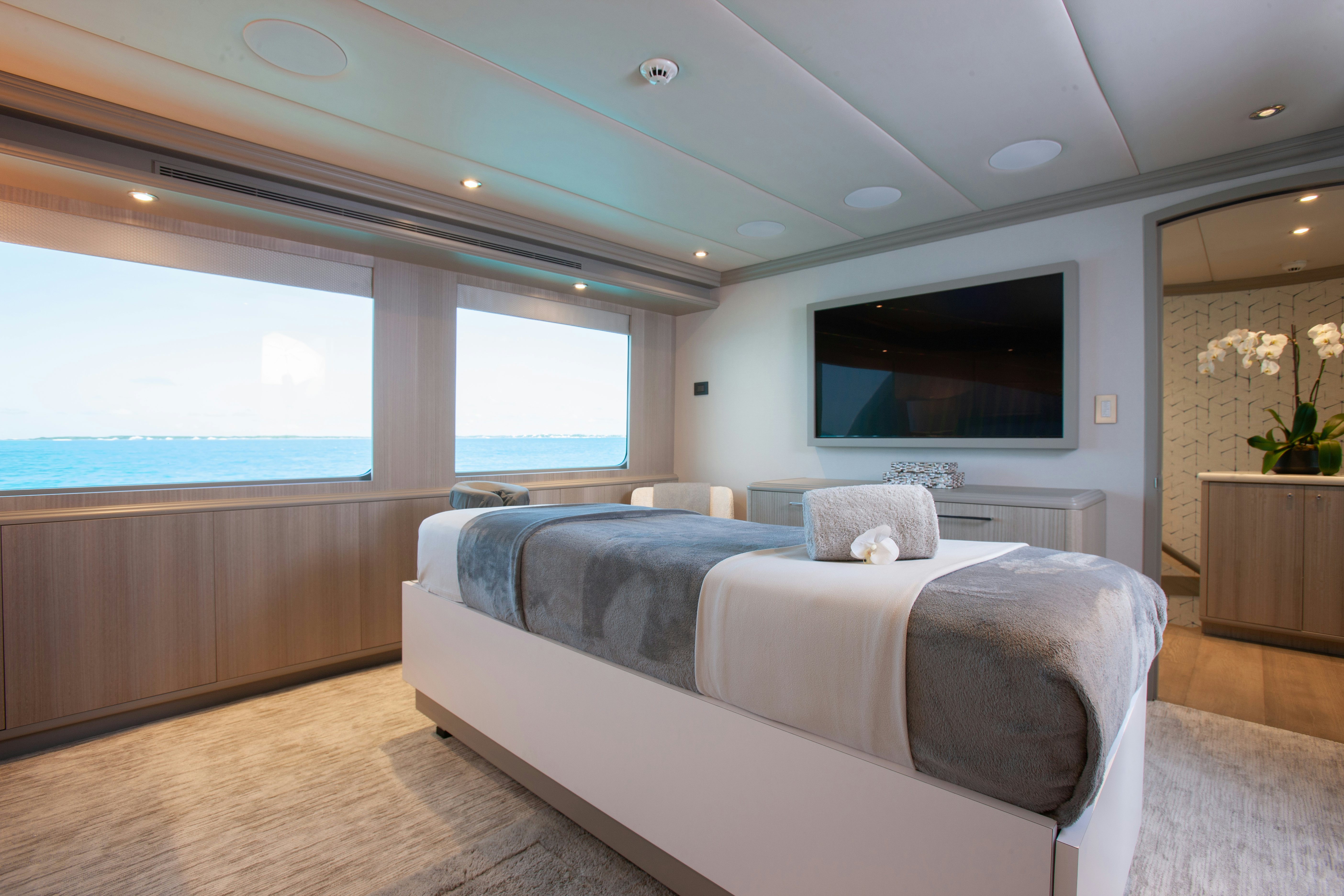 a bedroom with a large bed aboard NO BAD IDEAS Yacht for Sale