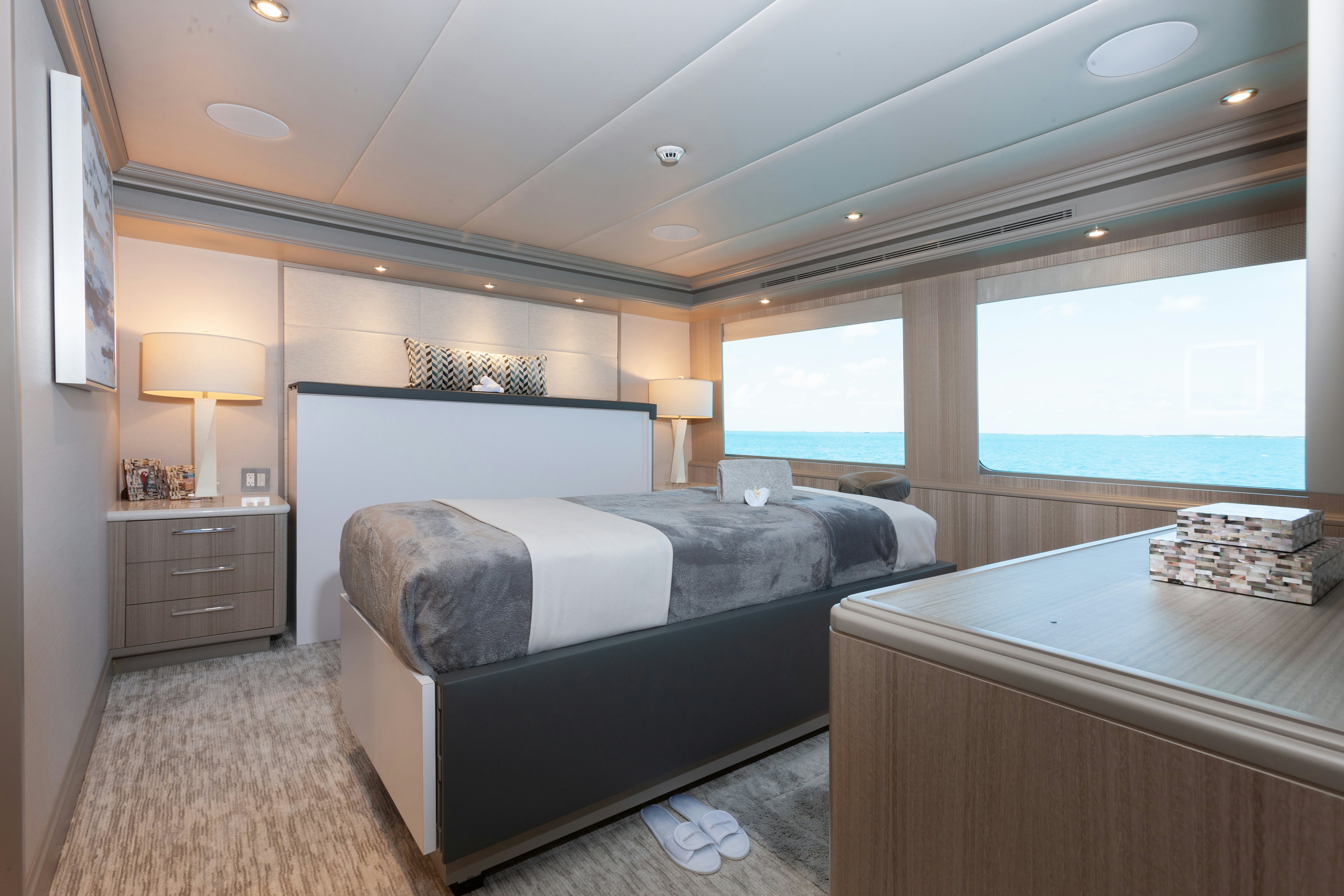a bedroom with a large bed aboard NO BAD IDEAS Yacht for Sale