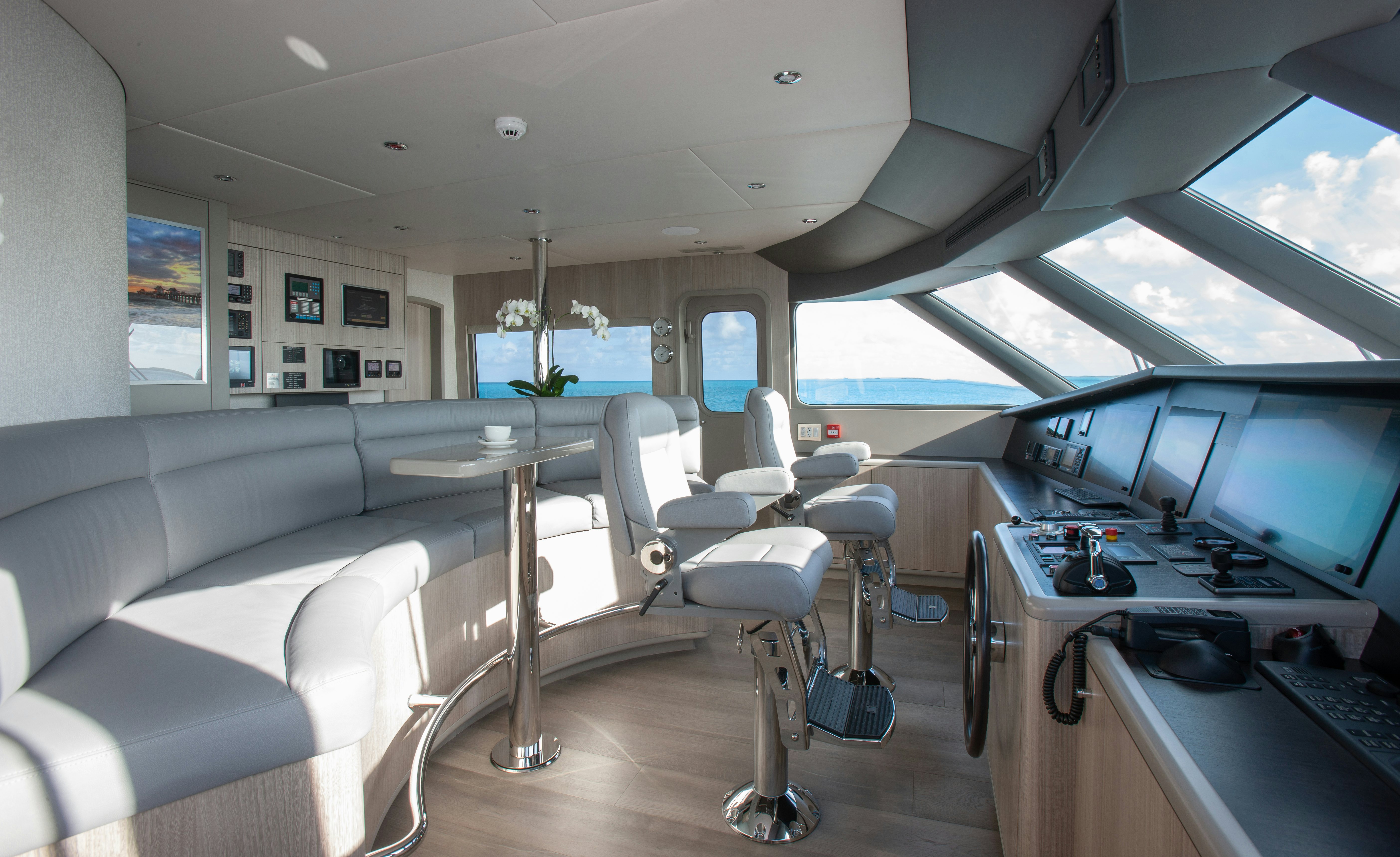 a room with a desk and chairs aboard NO BAD IDEAS Yacht for Sale
