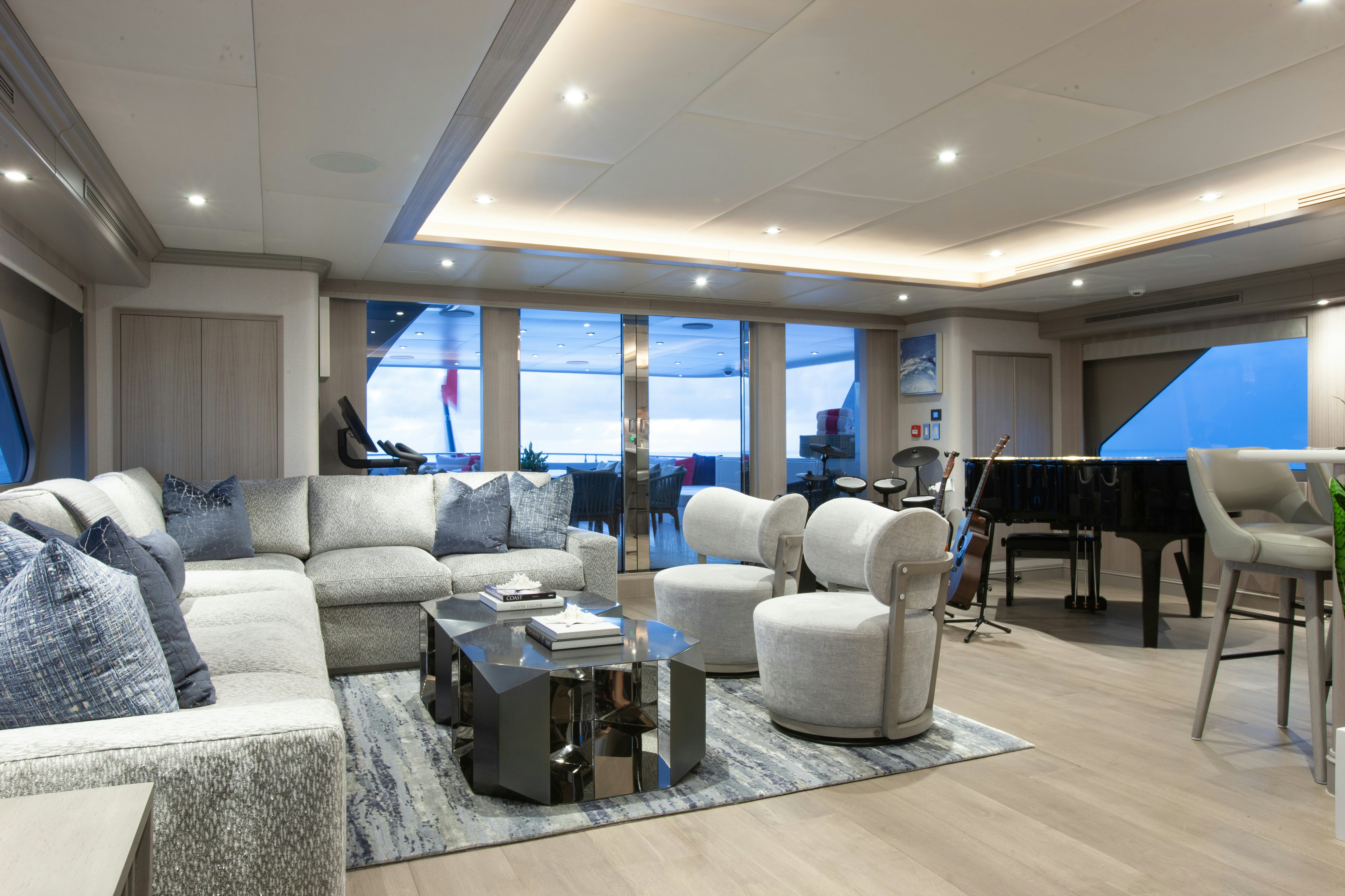 a living room with a large window aboard NO BAD IDEAS Yacht for Sale