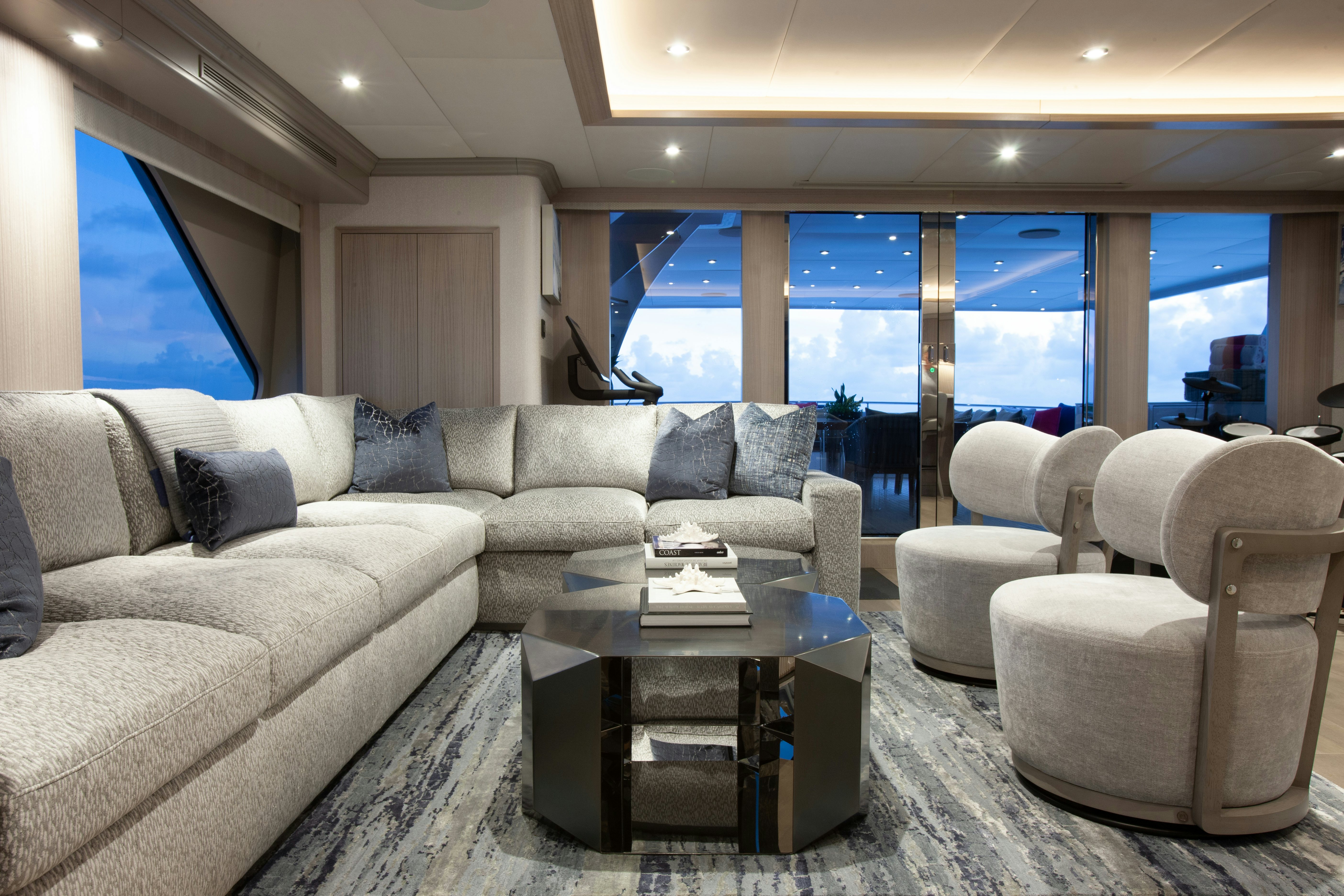 a living room with a large window aboard NO BAD IDEAS Yacht for Sale