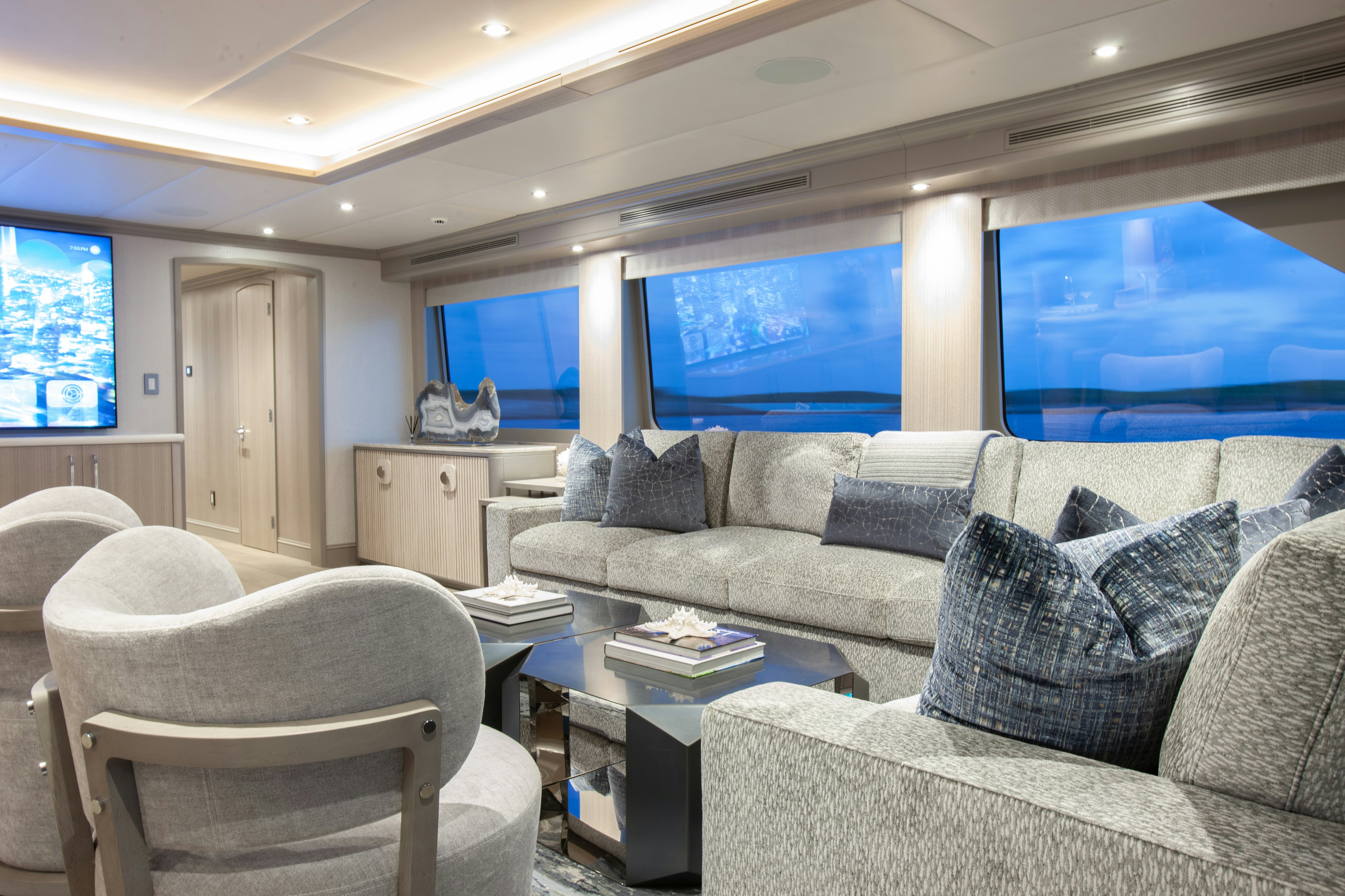 a living room with a large window aboard NO BAD IDEAS Yacht for Sale