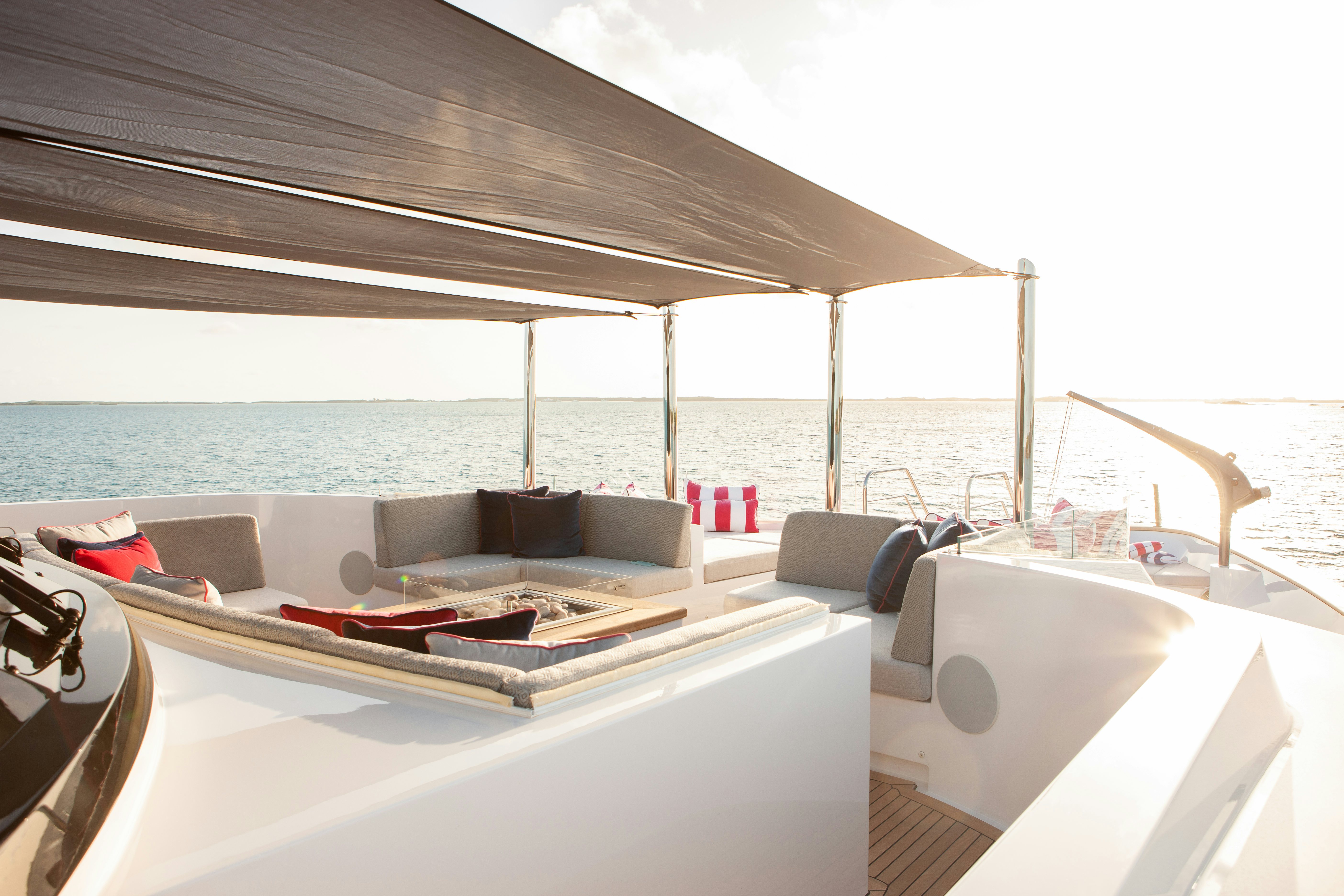 a boat with a bed and a chair on the deck aboard NO BAD IDEAS Yacht for Sale