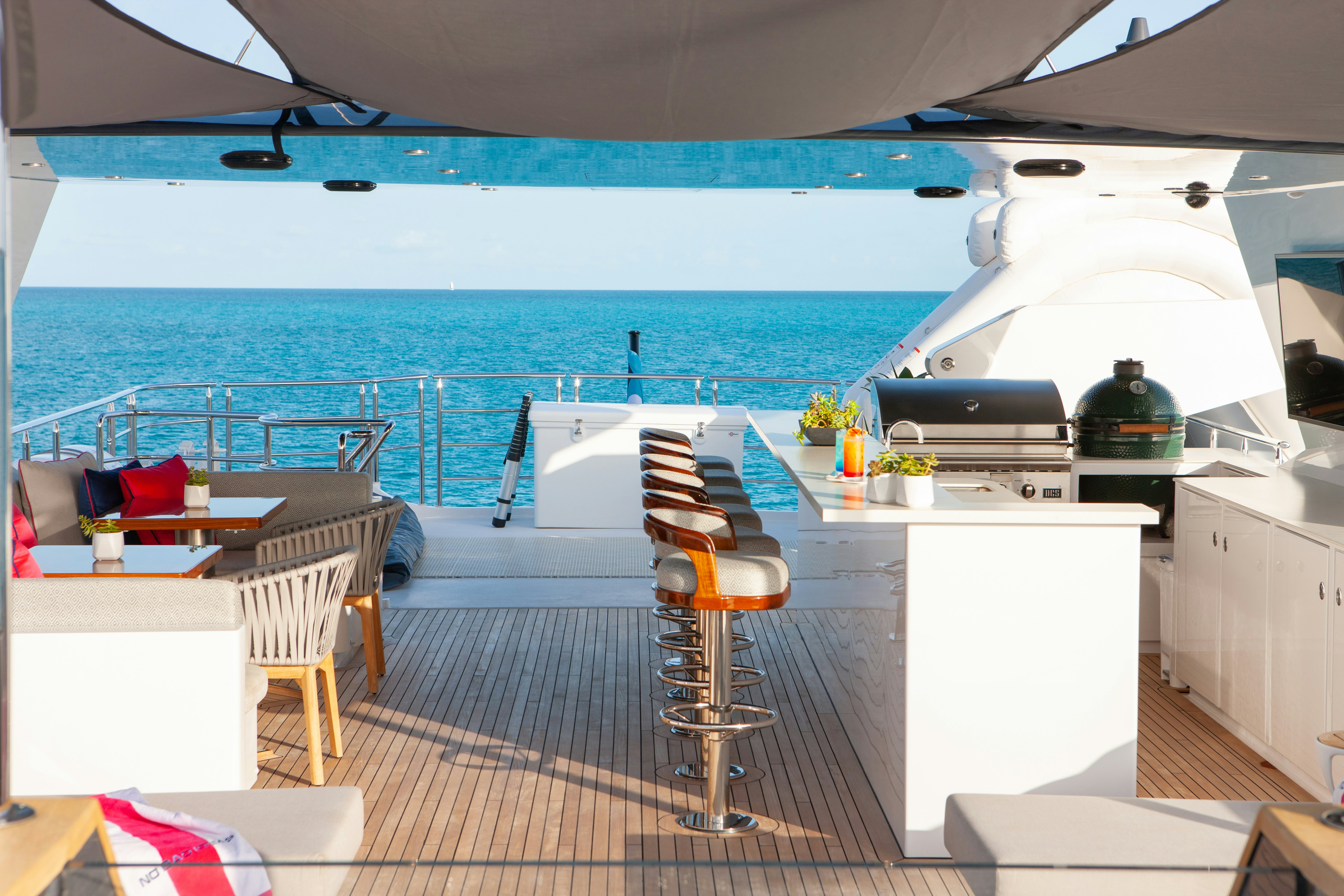 a kitchen with a table and chairs aboard NO BAD IDEAS Yacht for Sale
