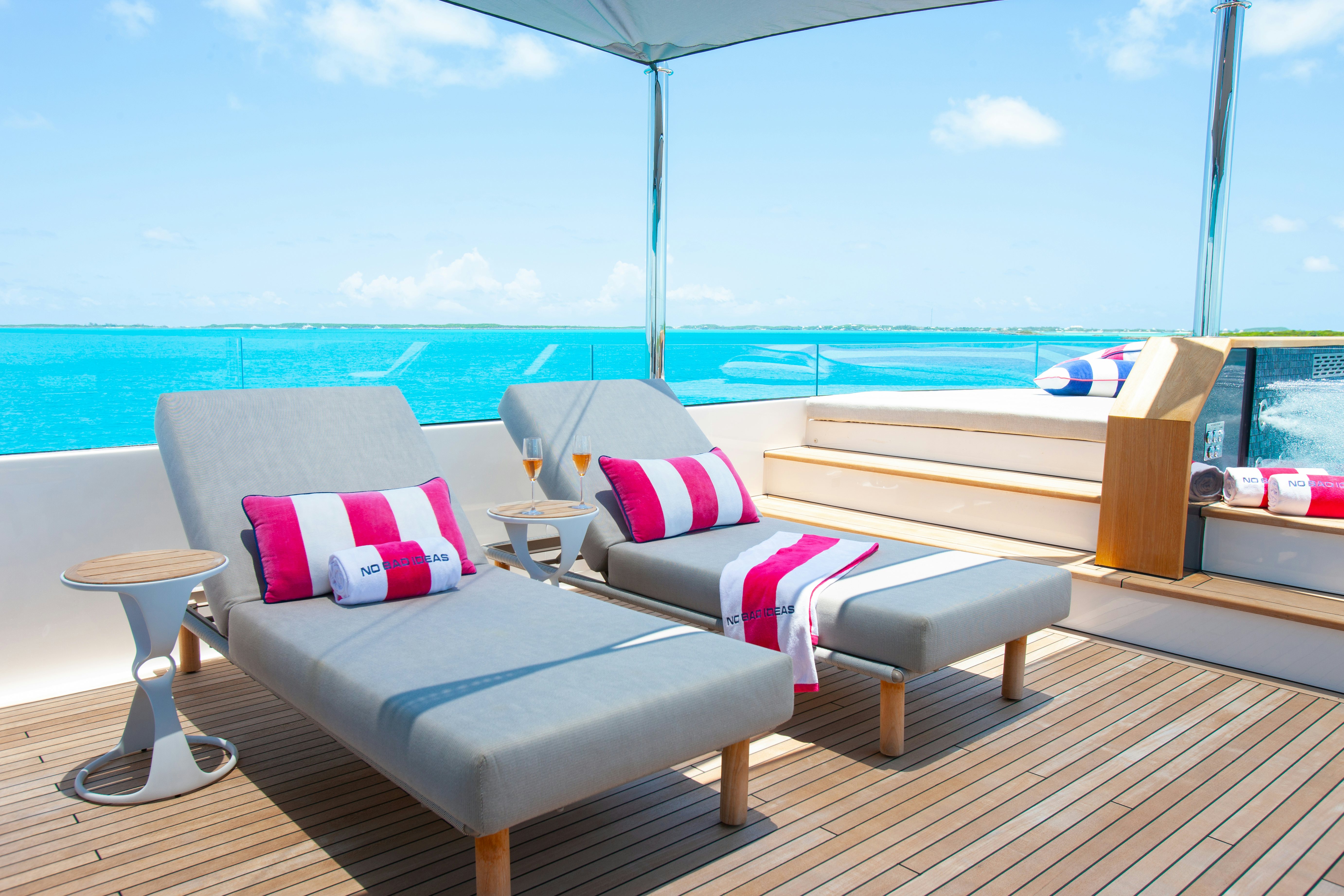 a room with a couch and a pool aboard NO BAD IDEAS Yacht for Sale
